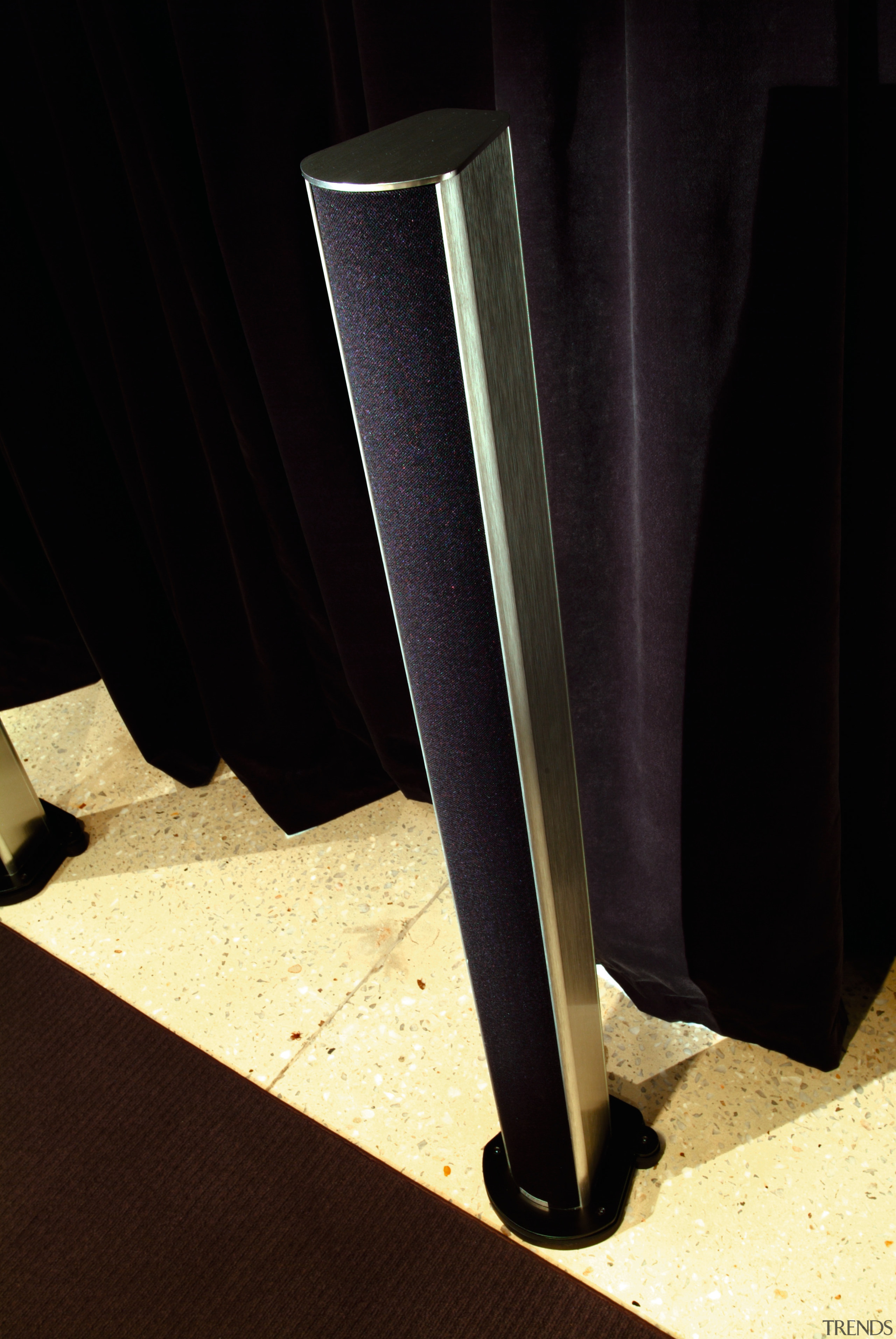 Image of floor standing speakers in the home light, product design, black