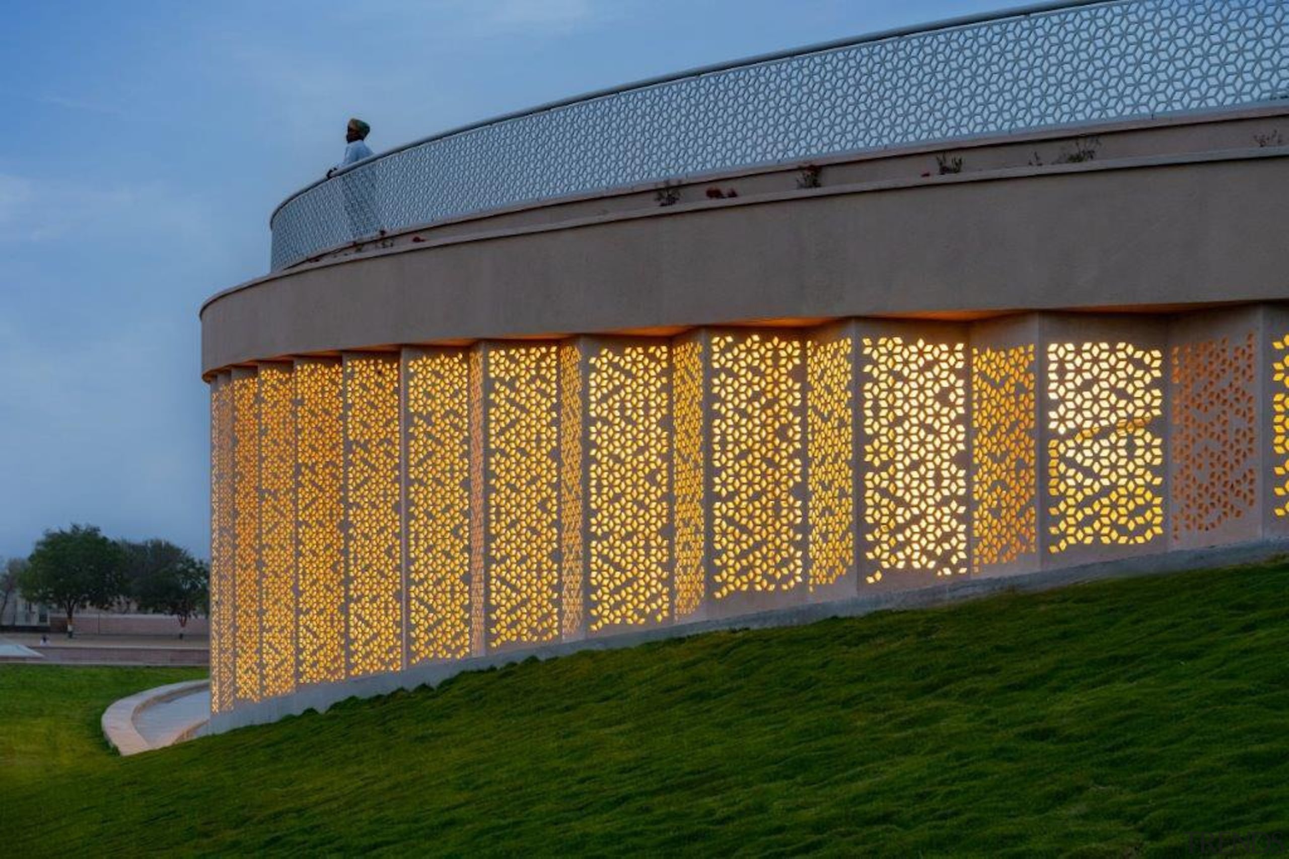 The library at dusk with its screens backlit 