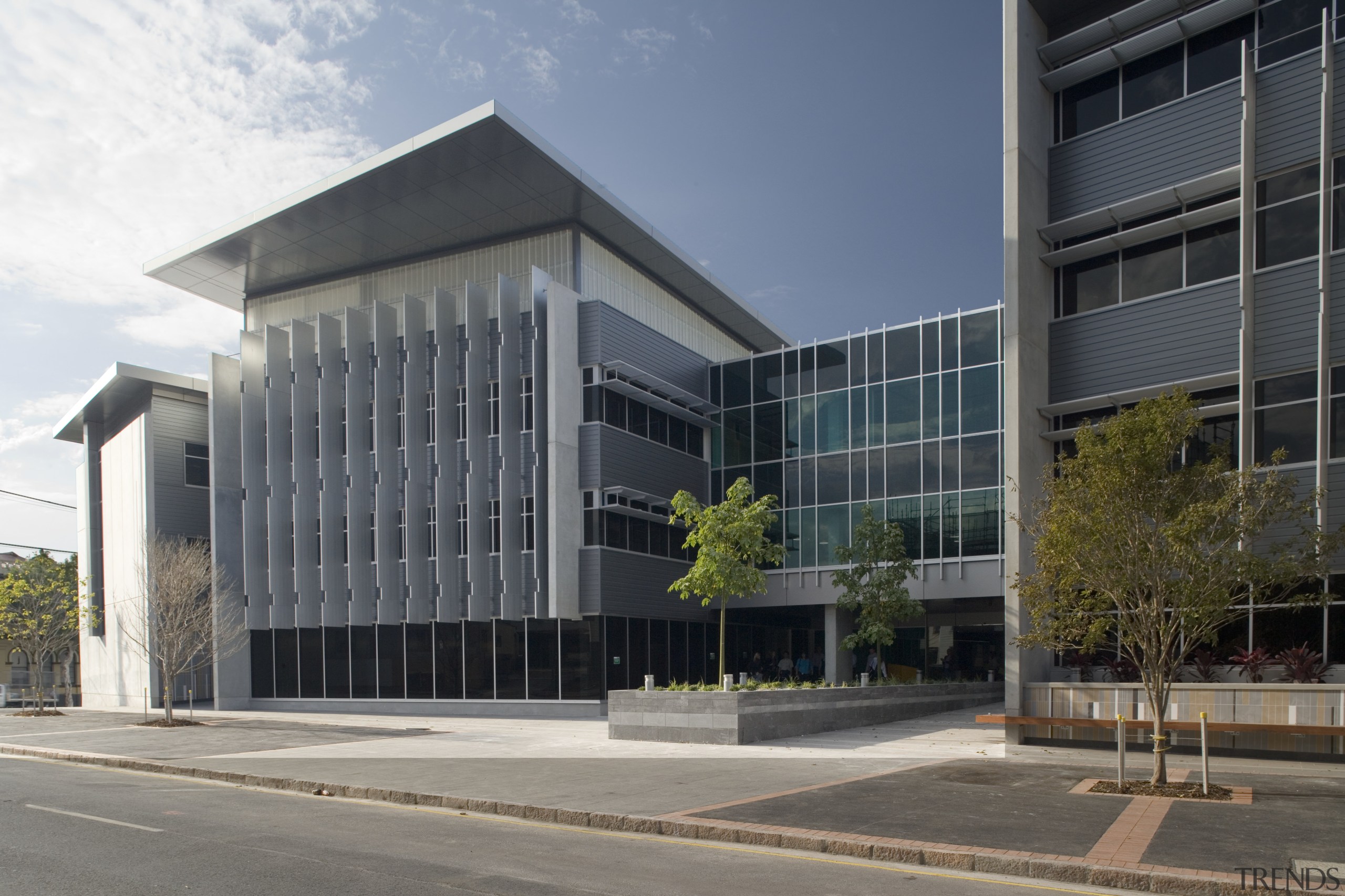 An exterior view of the greensquare building. Butler architecture, building, commercial building, condominium, corporate headquarters, facade, headquarters, mixed use, property, real estate, gray, black