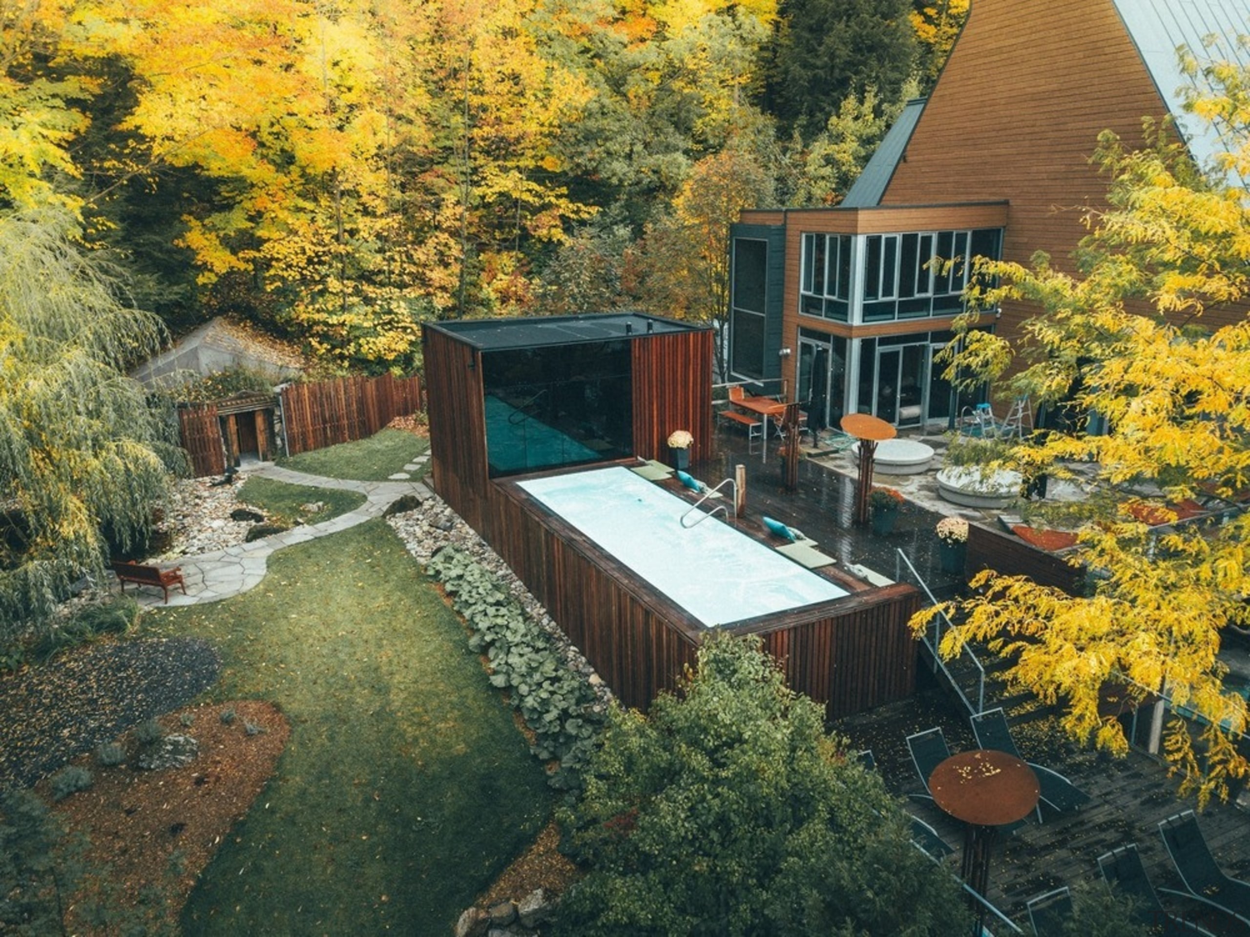 The new pavilion adds capacity to the spa, architecture, autumn, backyard, building, cottage, courtyard, design, estate, garden, home, house, landscape, landscaping, leaf, mountain, nature, plant, property, real estate, residential area, roof, sky, tree, woody plant, yard, yellow, brown