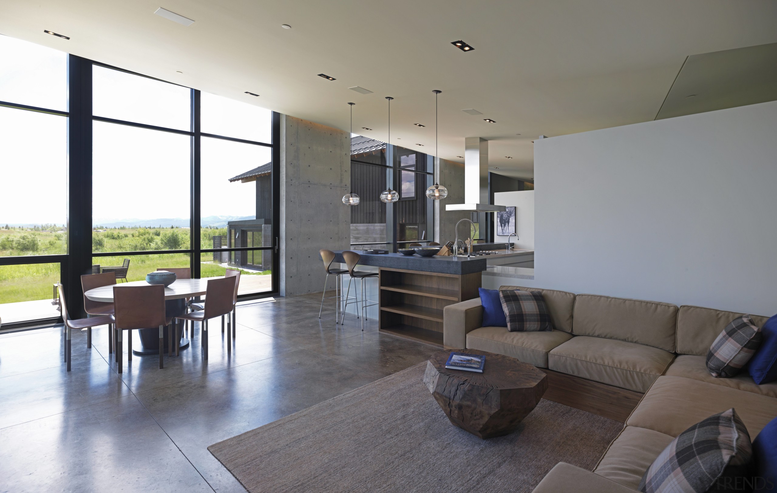 This open-plan kitchen in a mountain home is apartment, architecture, floor, flooring, house, interior design, living room, lobby, property, real estate, window, gray