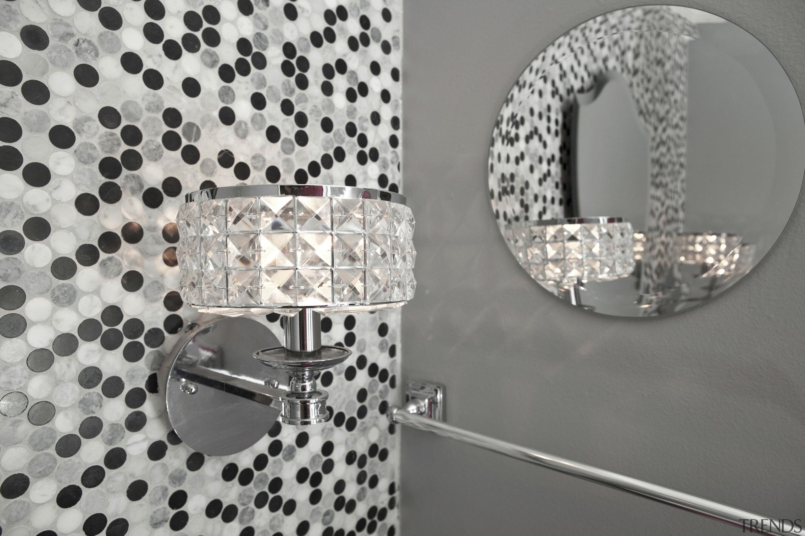 View of lamp, mirror and spotted wallcovering. - design, font, pattern, product, product design, gray