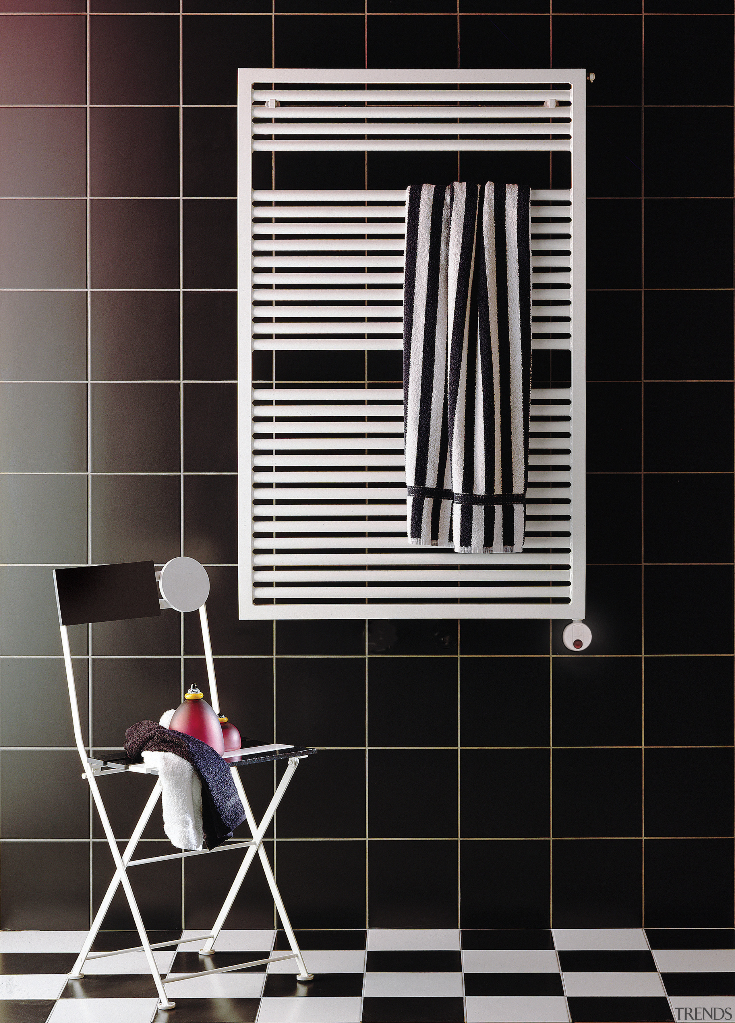 View of a bathroom which features a towel black, floor, flooring, furniture, interior design, line, product, product design, shelf, shelving, tile, wall, window, black