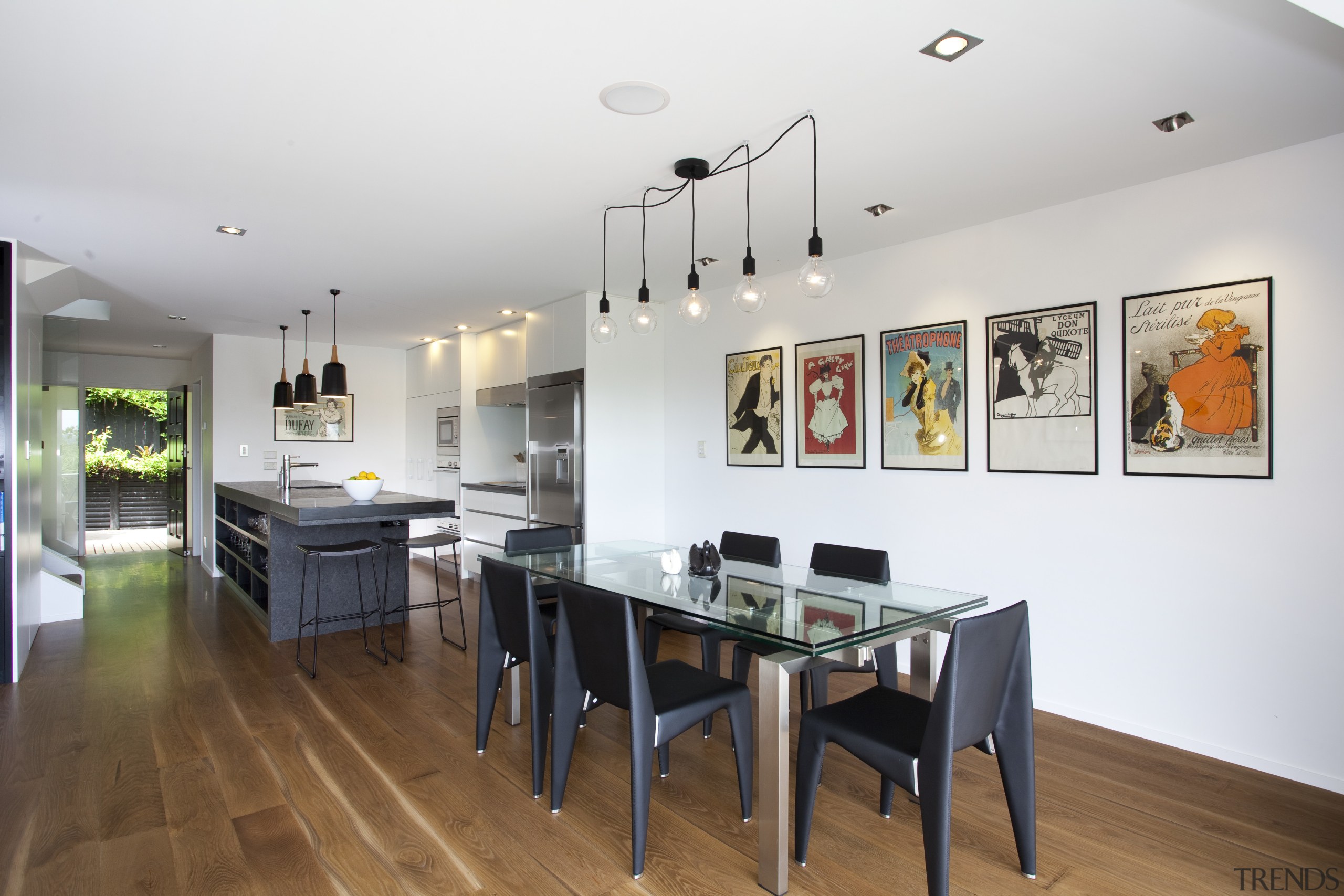 This renovated 1970s townhouse by architect-designer Evelyn McNamara dining room, floor, interior design, real estate, room, table, white