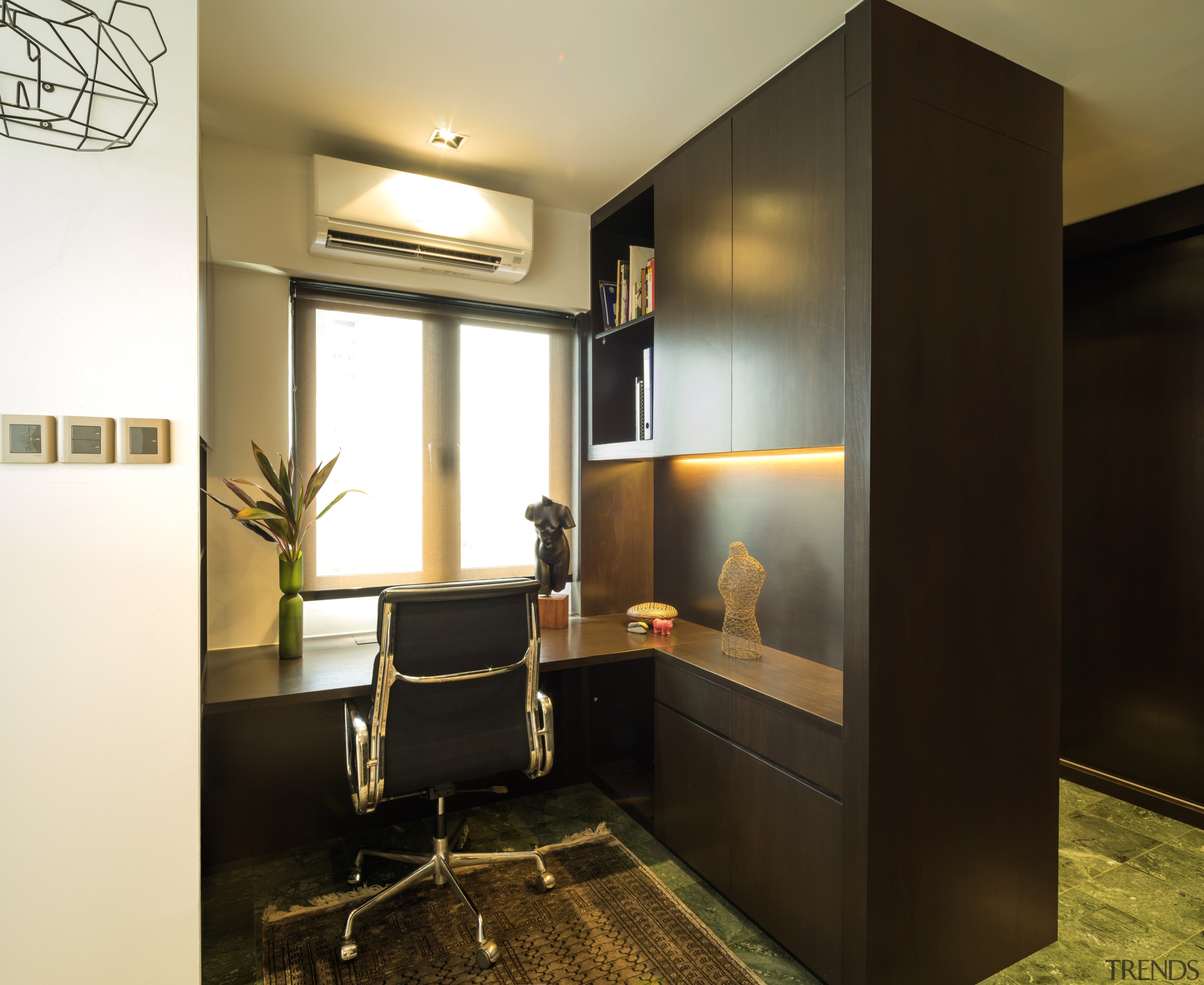 The master suite in this remodelled apartment occupies ceiling, furniture, interior design, room, black, brown