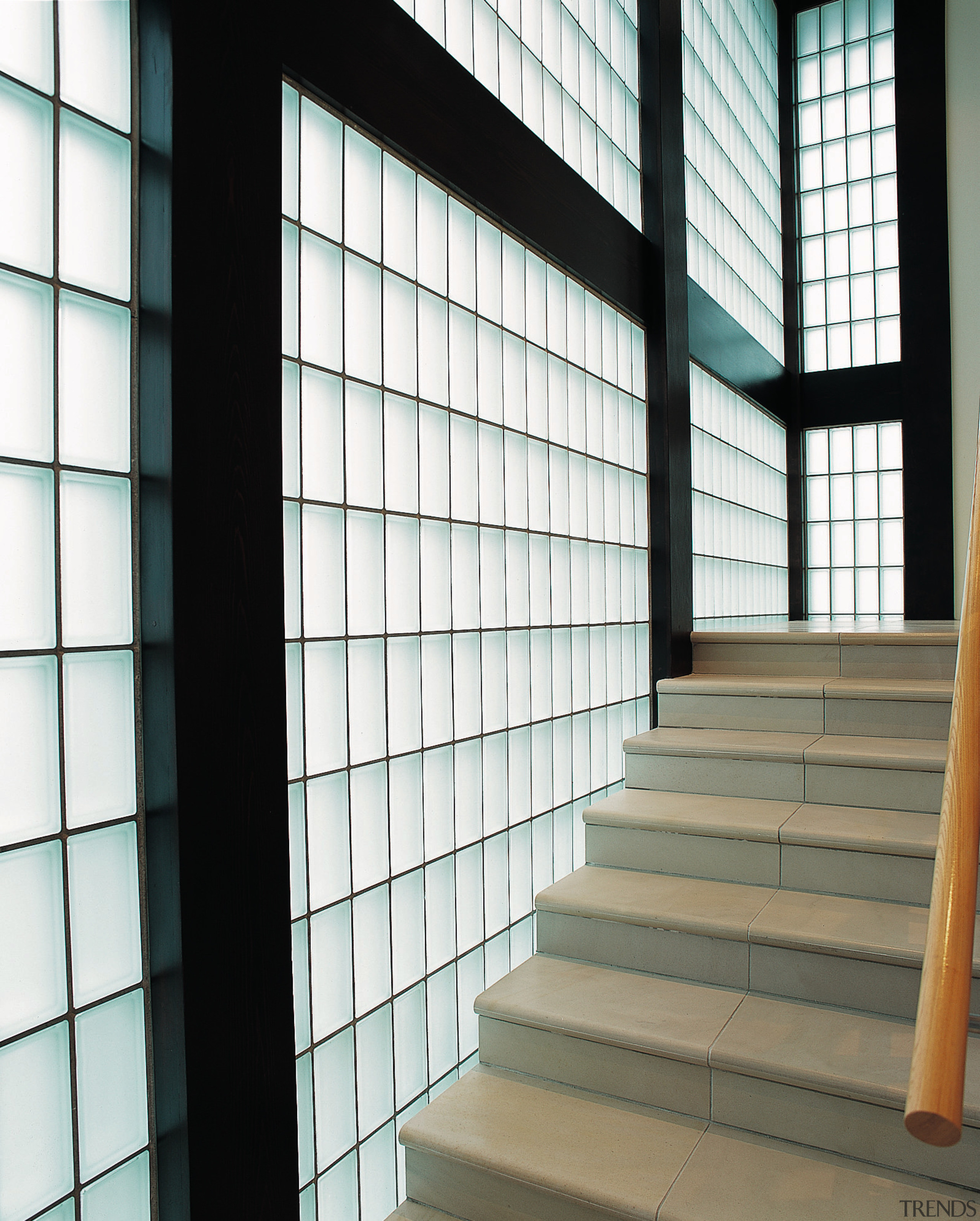 A stairway featuring a glass block wall. There architecture, building, daylighting, facade, glass, line, structure, wall, window, white, black