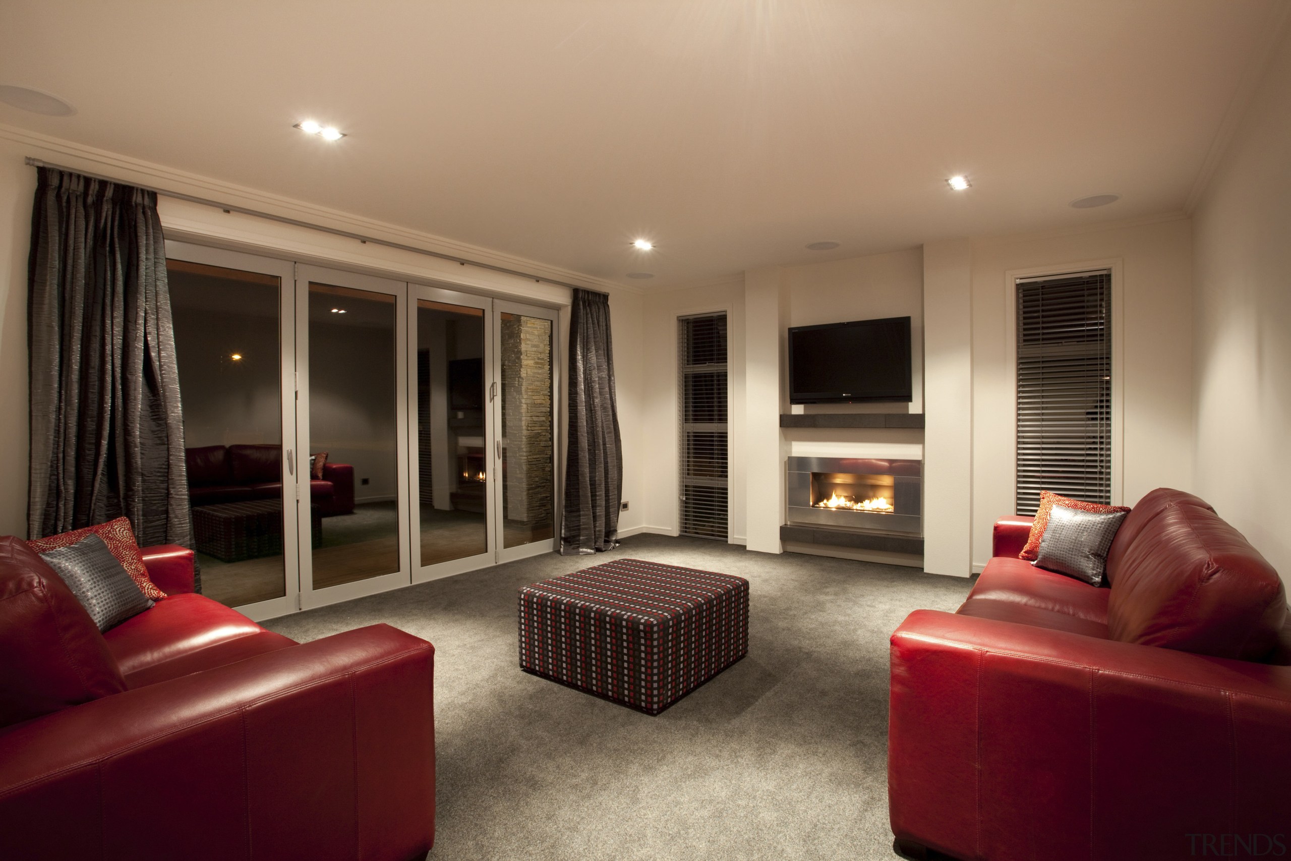 View of the lounge area which features red ceiling, floor, flooring, interior design, living room, property, real estate, room, suite, brown, orange, red