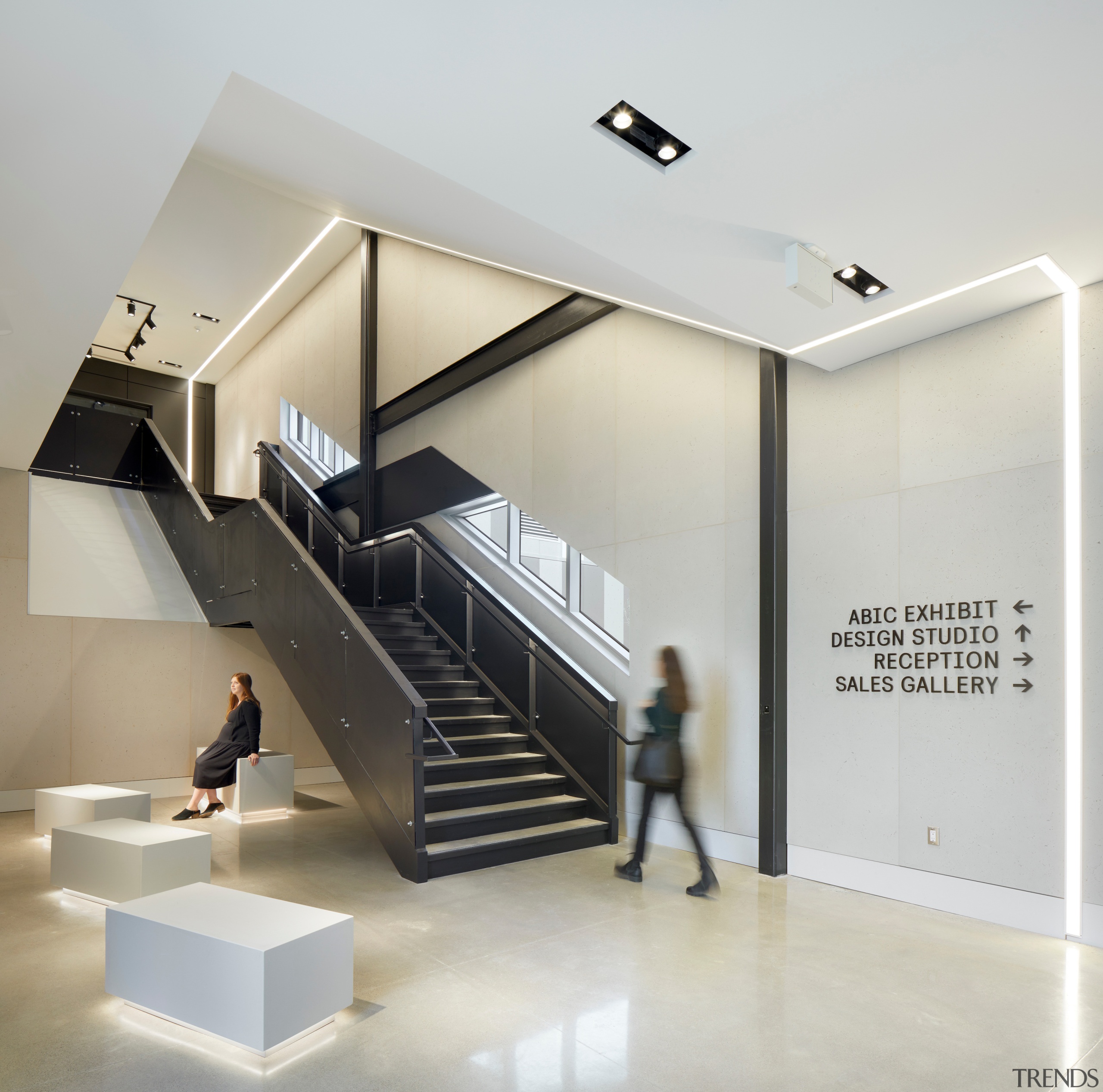 Novel, underlit furniture, circulation stair and wall signage. 