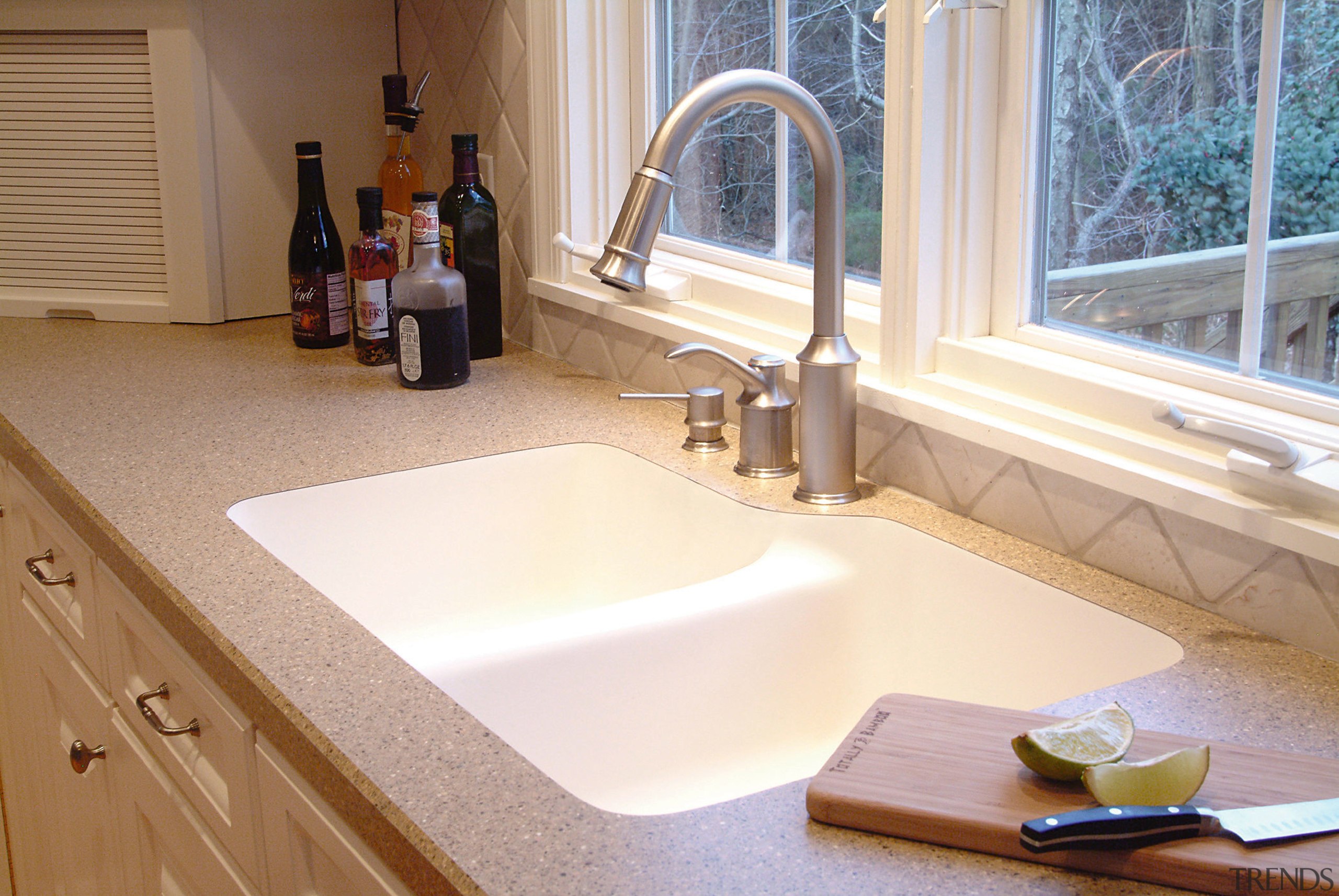 View of kitchen countertop showing undermount sink. bathroom, bathroom sink, countertop, floor, flooring, interior design, kitchen, plumbing fixture, room, sink, tap, white, brown