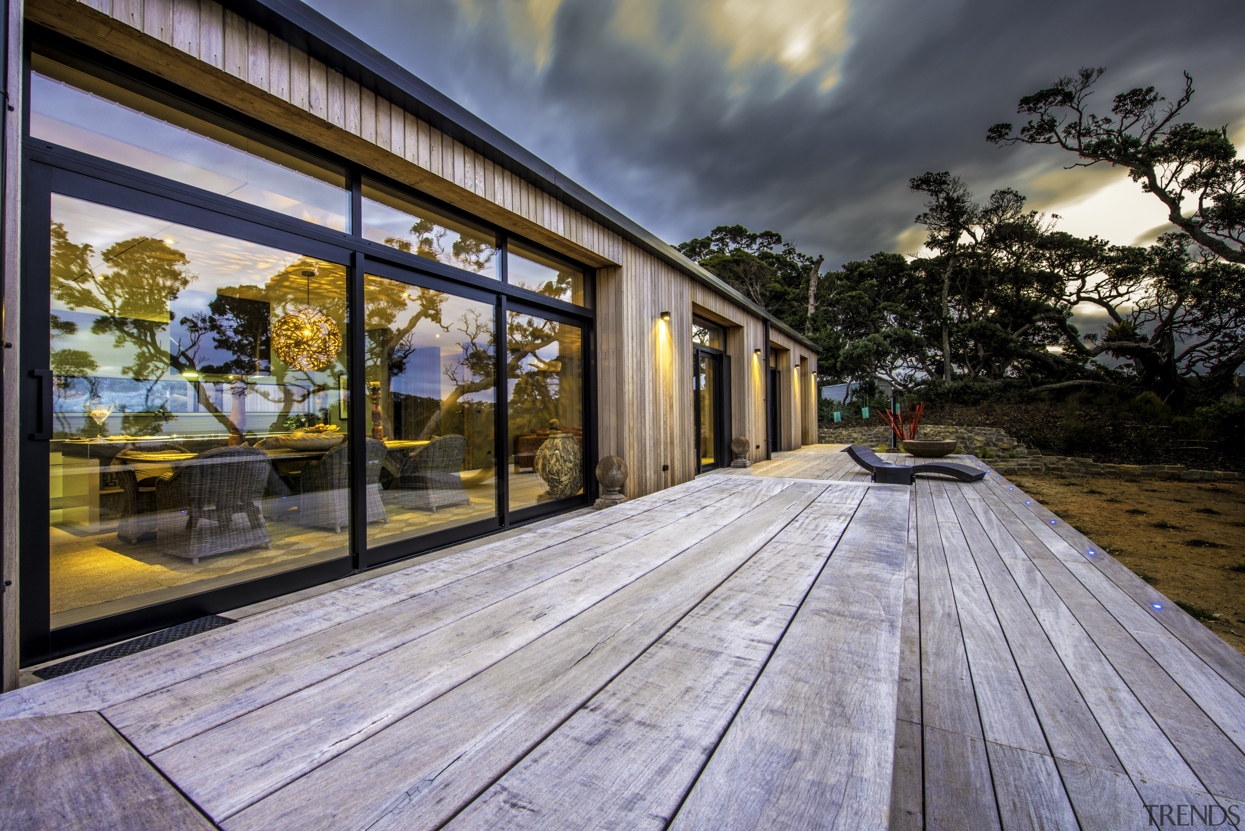 Black window frames keep this house looking sharp architecture, deck, estate, facade, home, house, property, real estate, siding, window, wood, gray