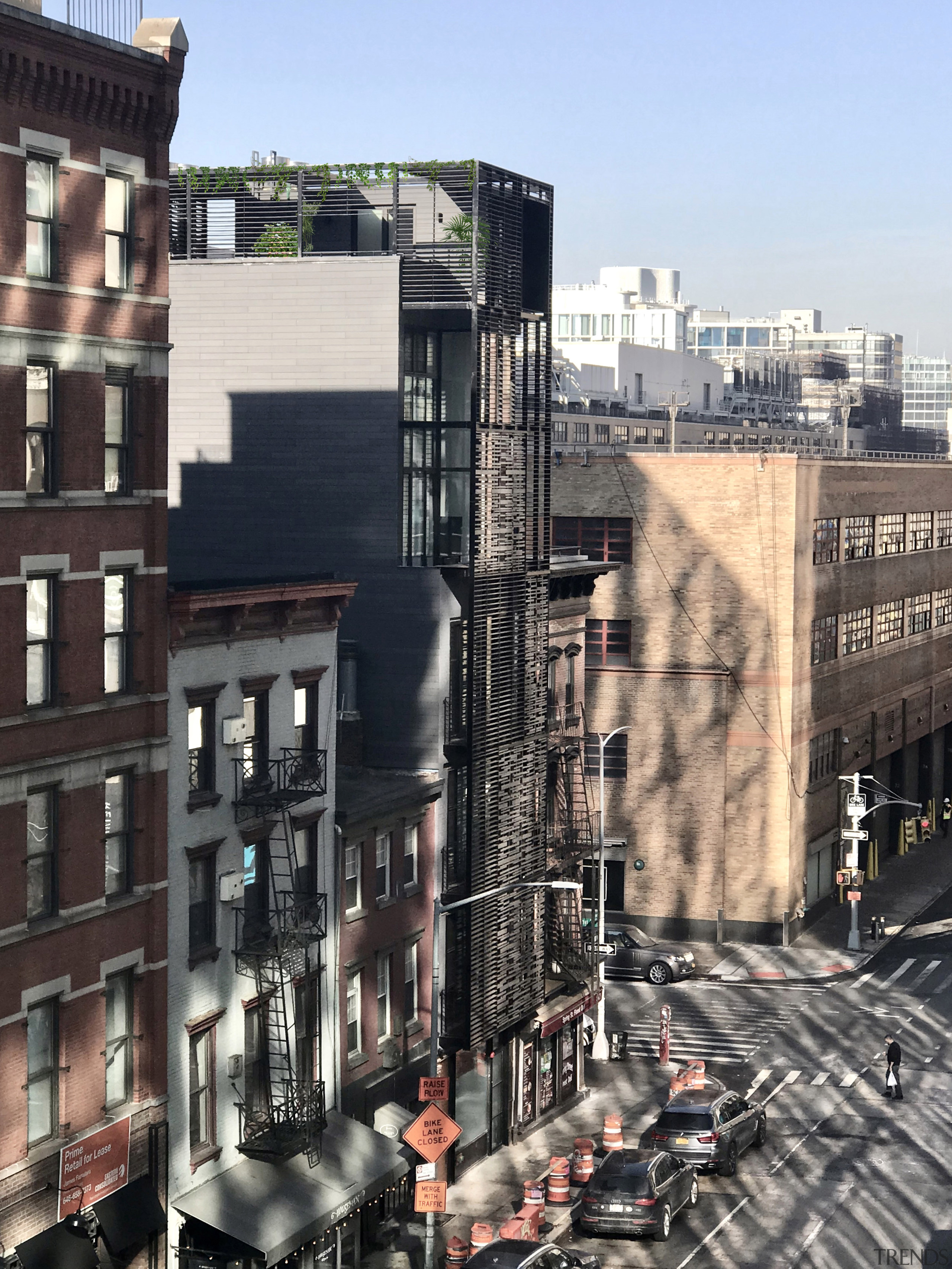 The townhouse melds demurely into the city fabric. 