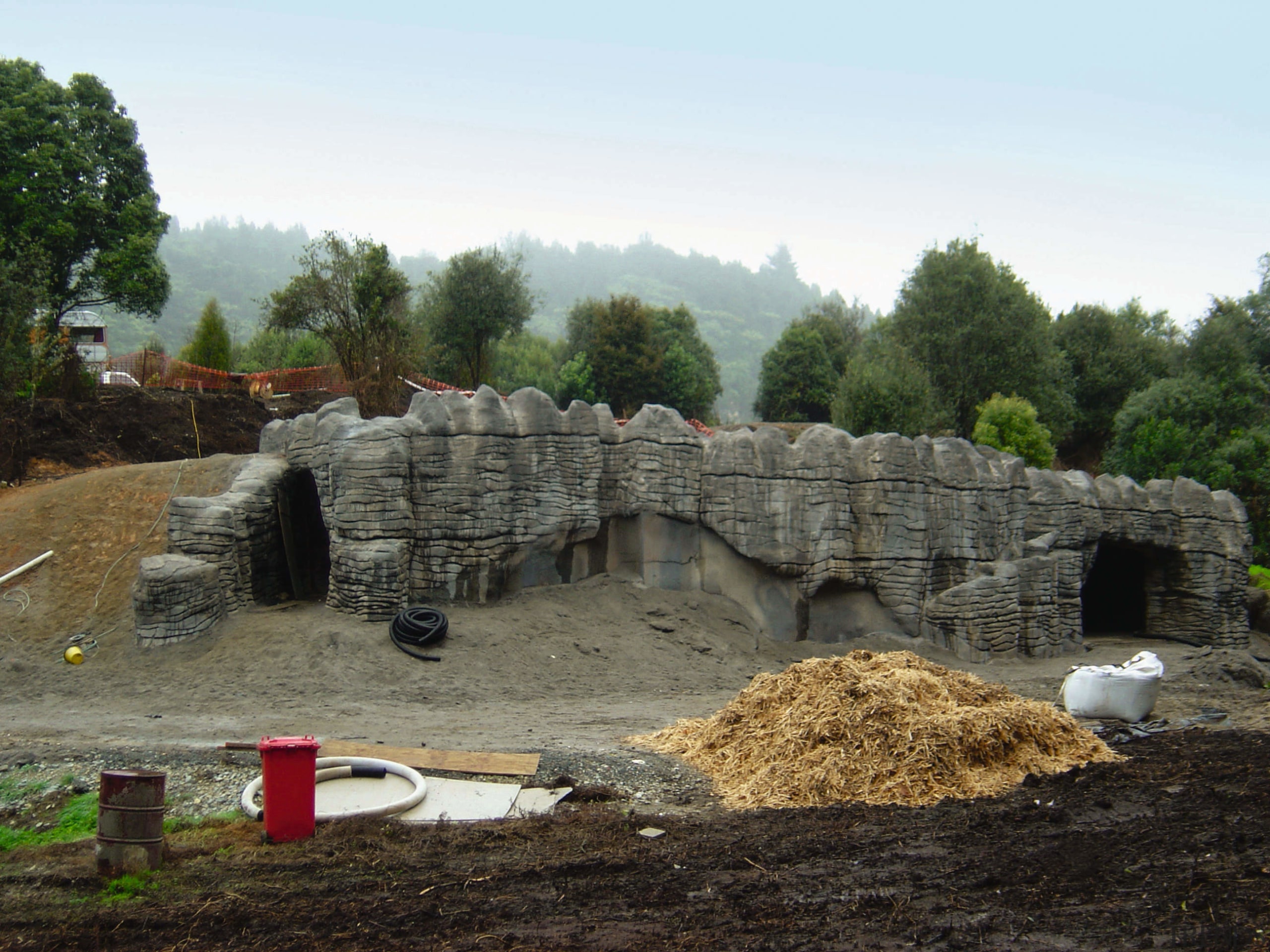 A view of some engineering work within a archaeological site, rock, stone wall, wall, white, black