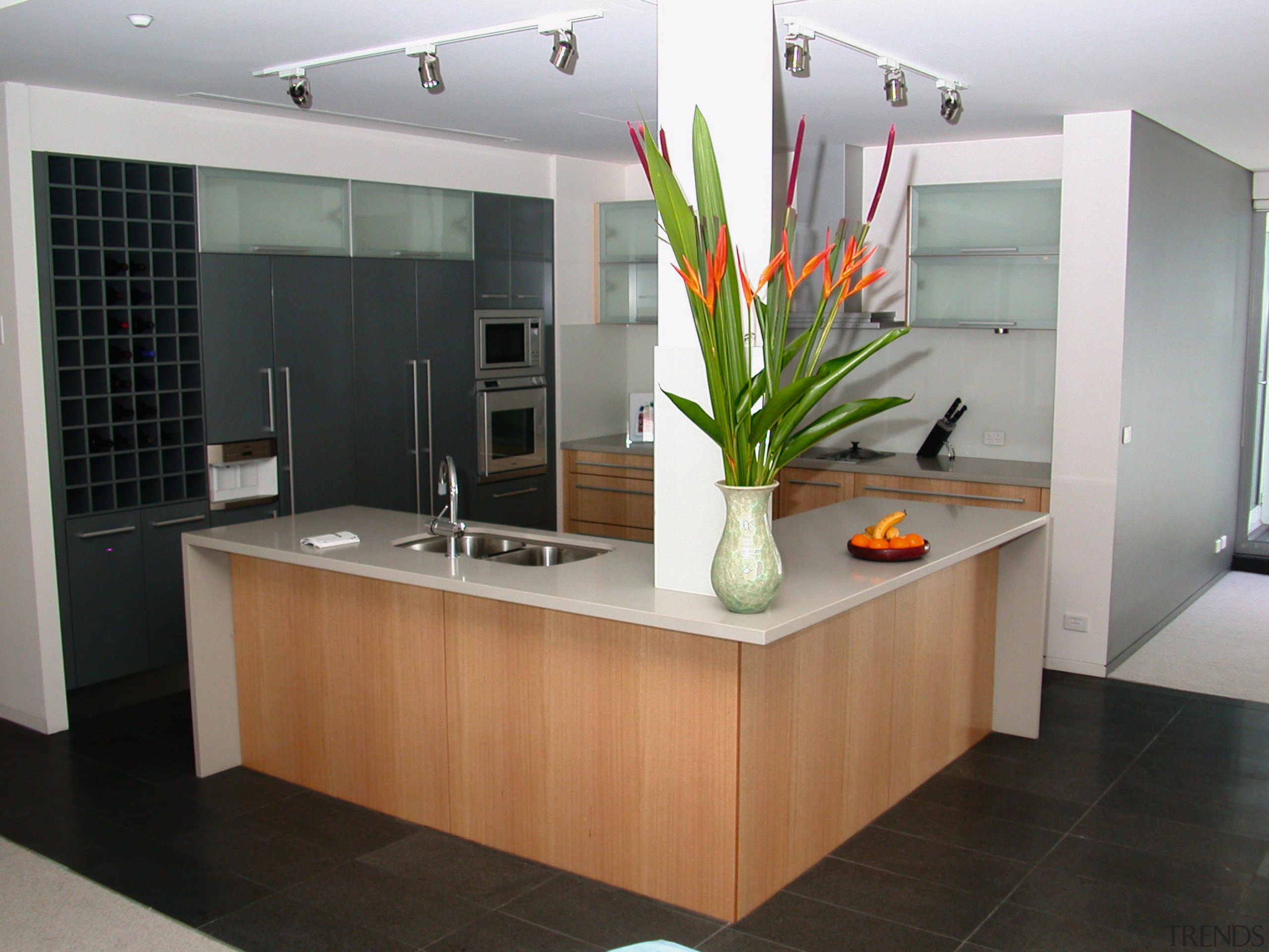 A view of a kitchen, black tiled floor, cabinetry, countertop, floor, interior design, kitchen, real estate, room, sink, gray, black