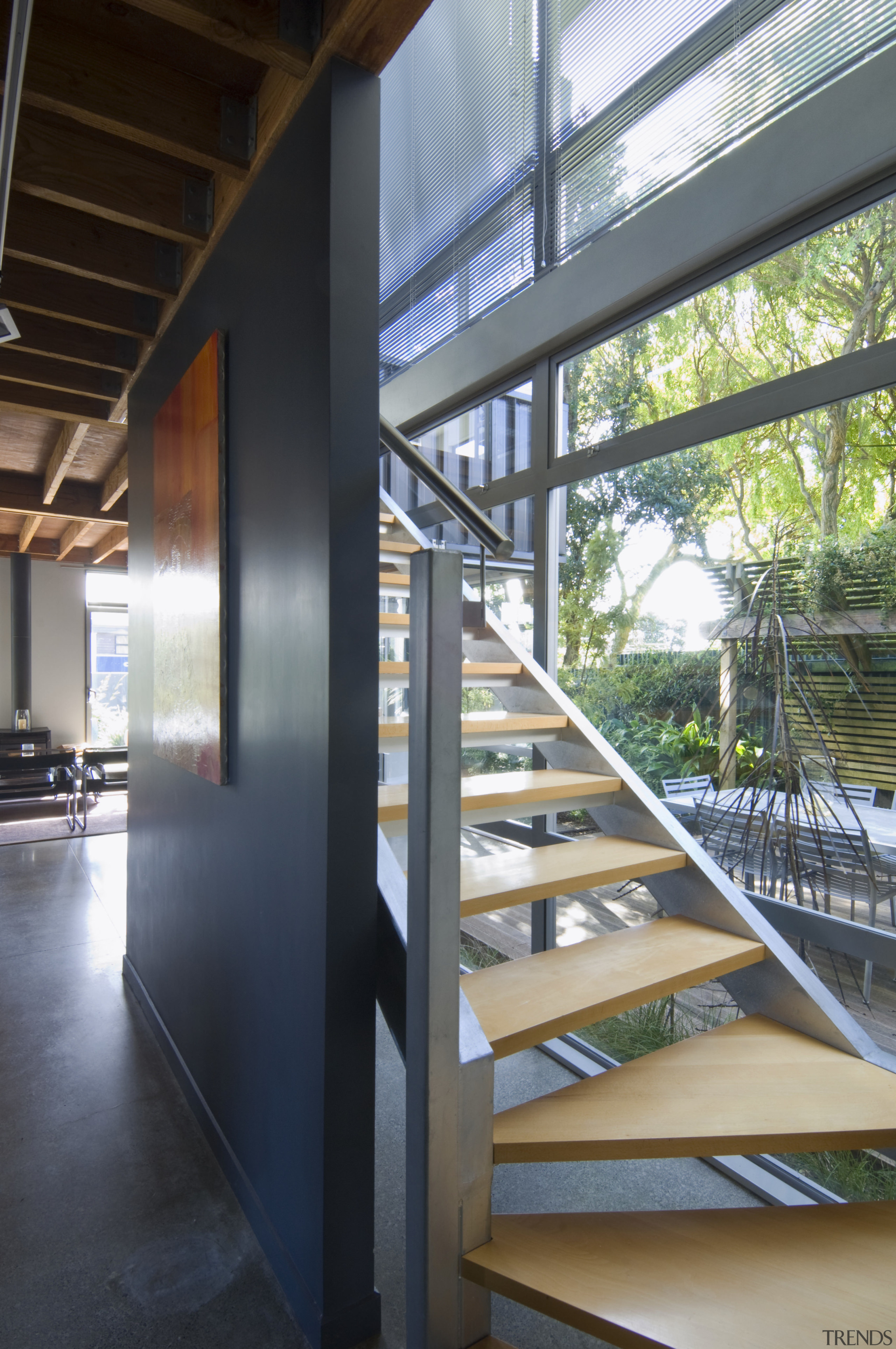 View of stairway with steel railing and timber architecture, daylighting, glass, handrail, stairs, structure, black, gray