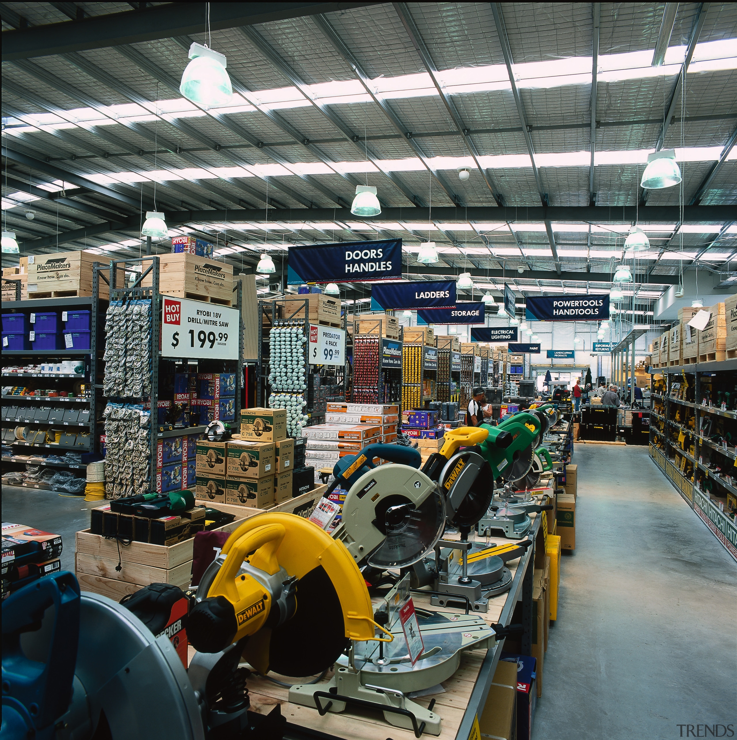 Interior of retail area showing power tools display, factory, industry, manufacturing, mass production, black, gray