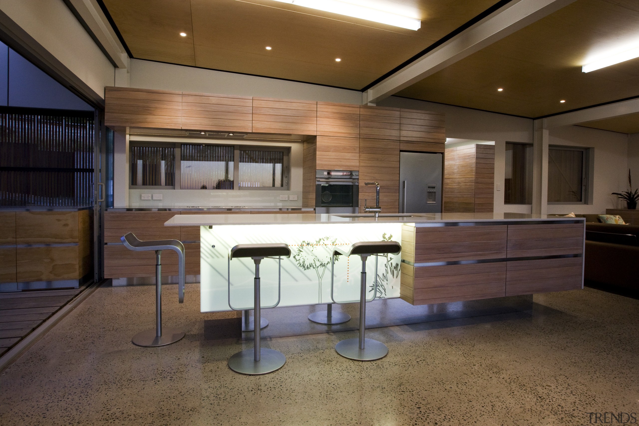 View of a kitchen which features an island architecture, cabinetry, ceiling, countertop, furniture, interior design, kitchen, wood, brown