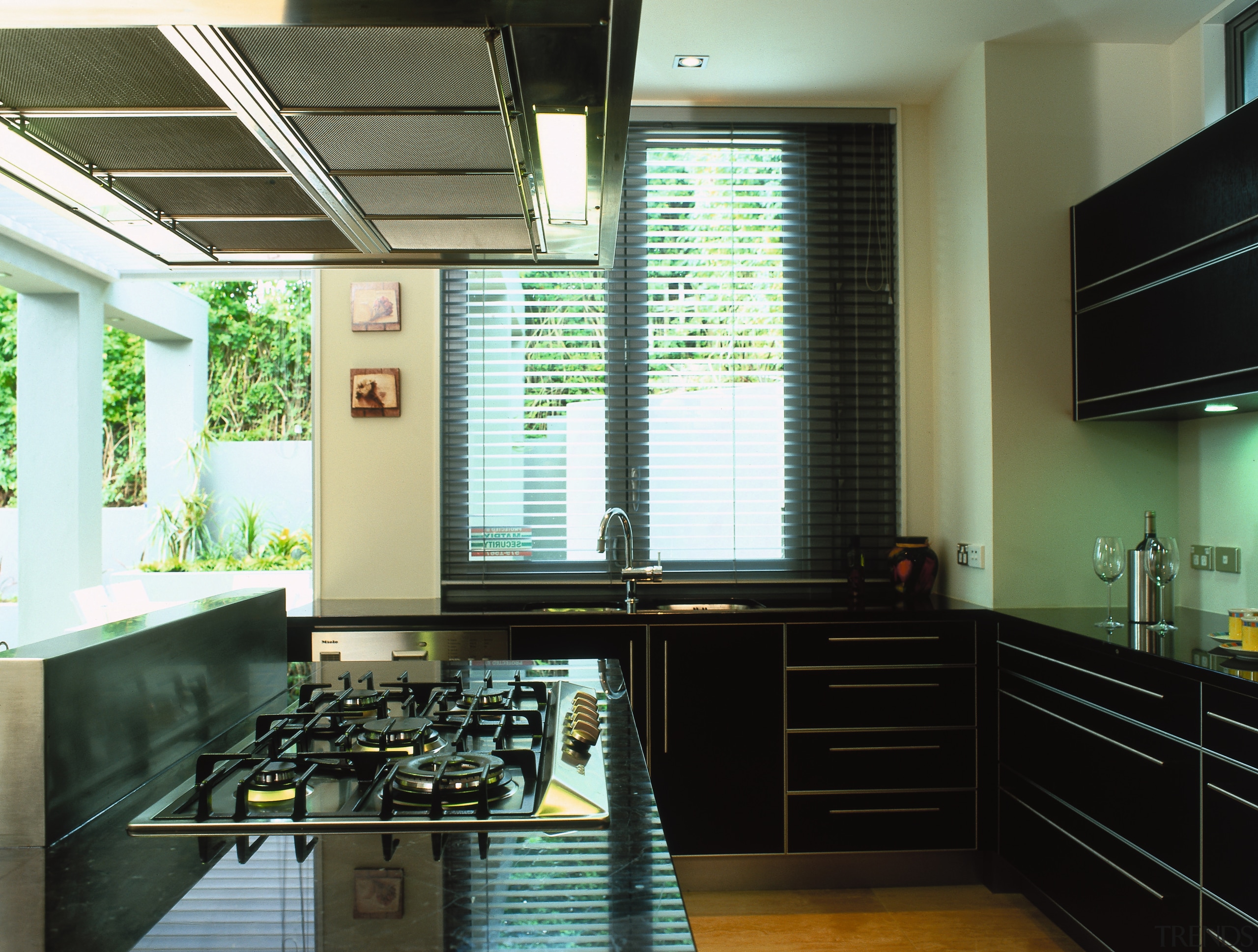 A view of a kitchen area, wooden cabinetry ceiling, countertop, interior design, kitchen, room, window, black