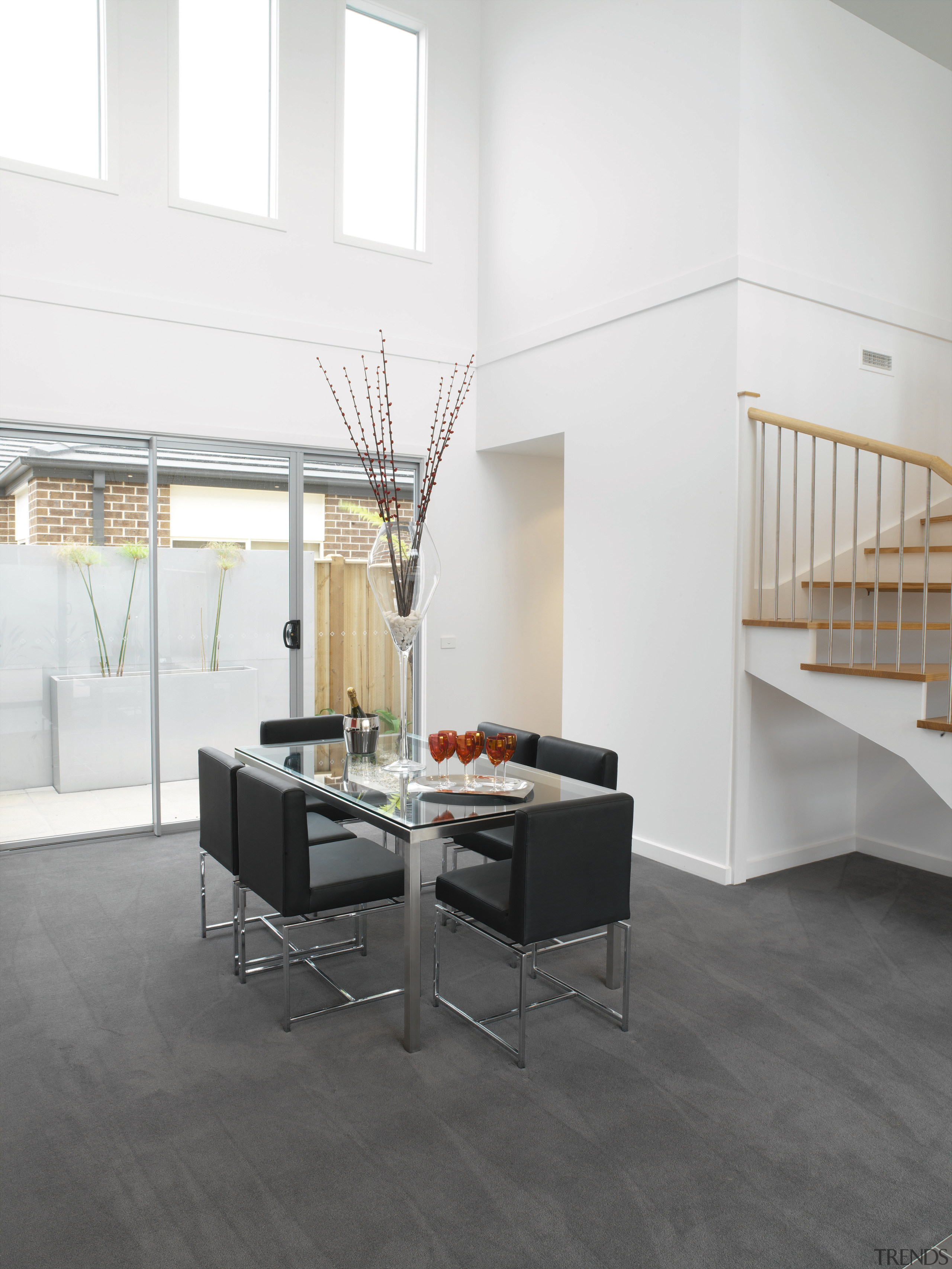 Dining room area with grey flooring, white walls, architecture, floor, flooring, furniture, hardwood, interior design, laminate flooring, loft, product design, table, tile, wall, wood, wood flooring, white, gray