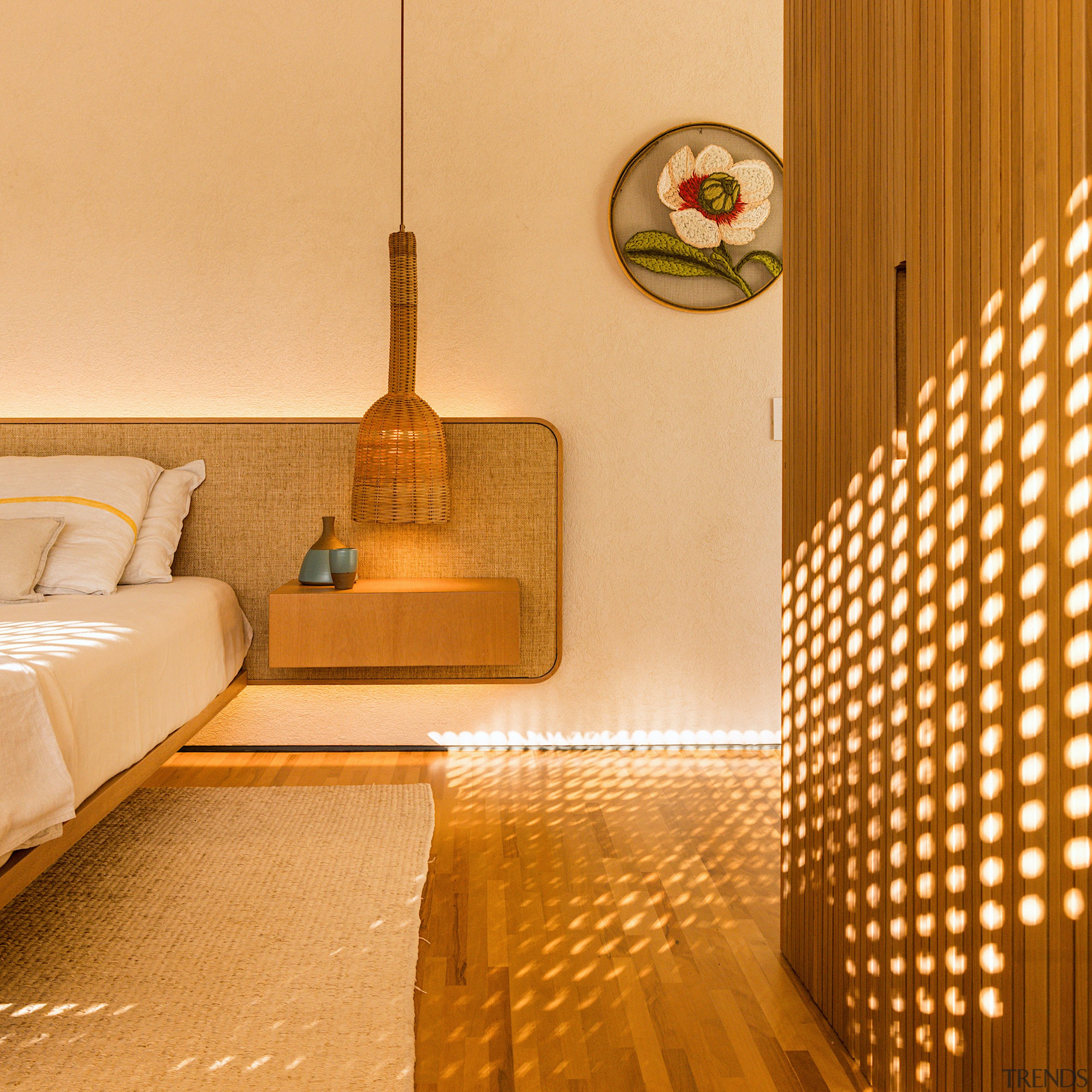 Wood, texture and sunlight – the master bedroom. 