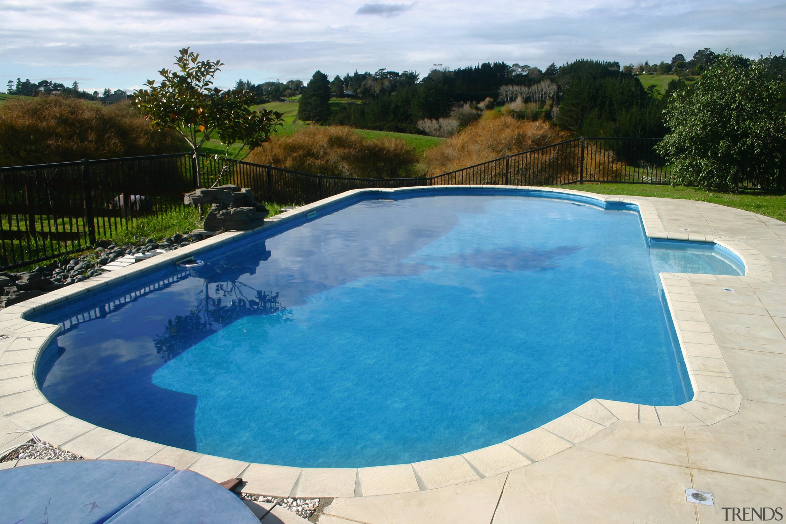 A view of a swimming pool by Cascade. backyard, estate, leisure, property, real estate, swimming pool, water, water resources, yard, white, teal