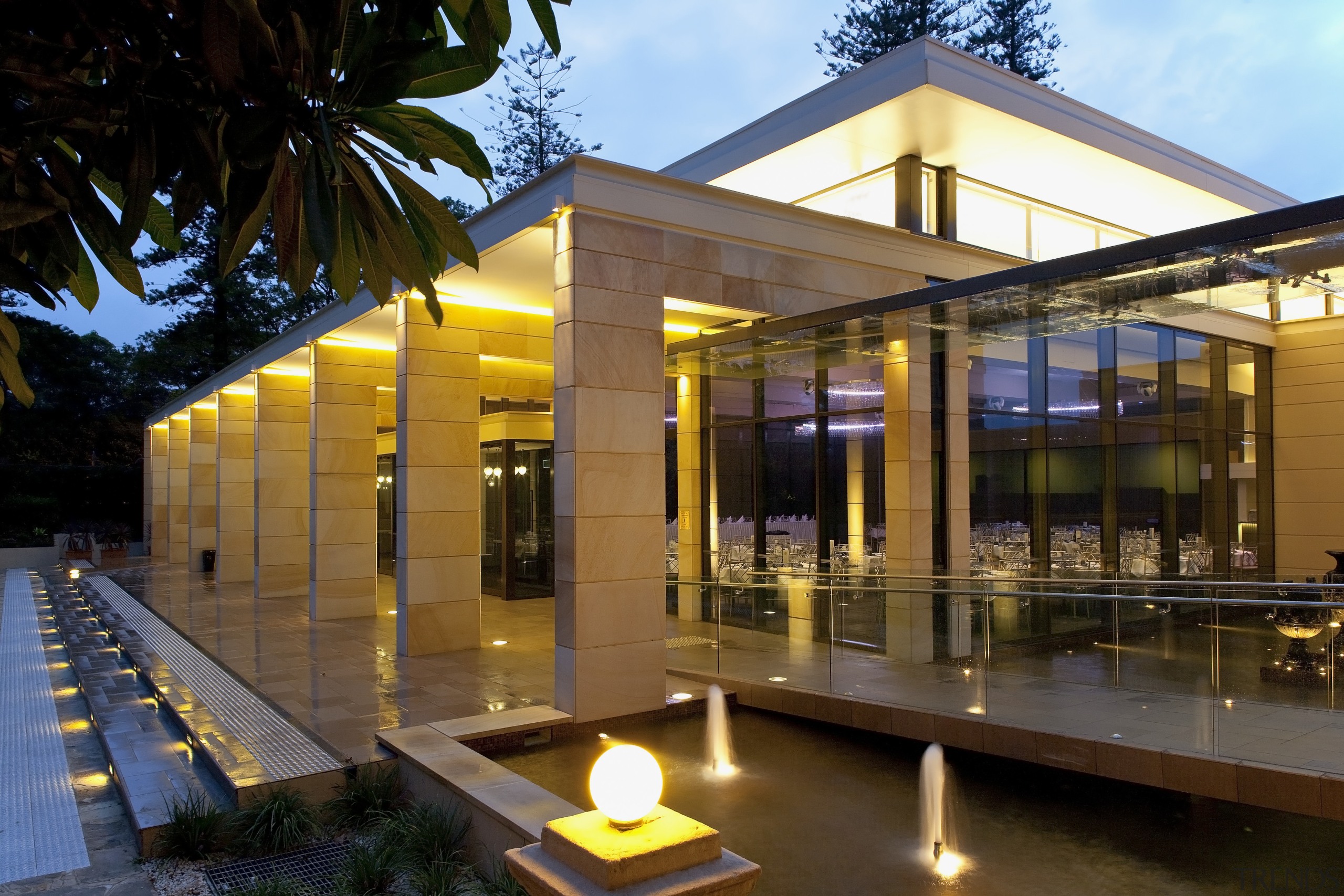 Exterior view of the hall features many lights architecture, condominium, home, house, lighting, real estate, brown