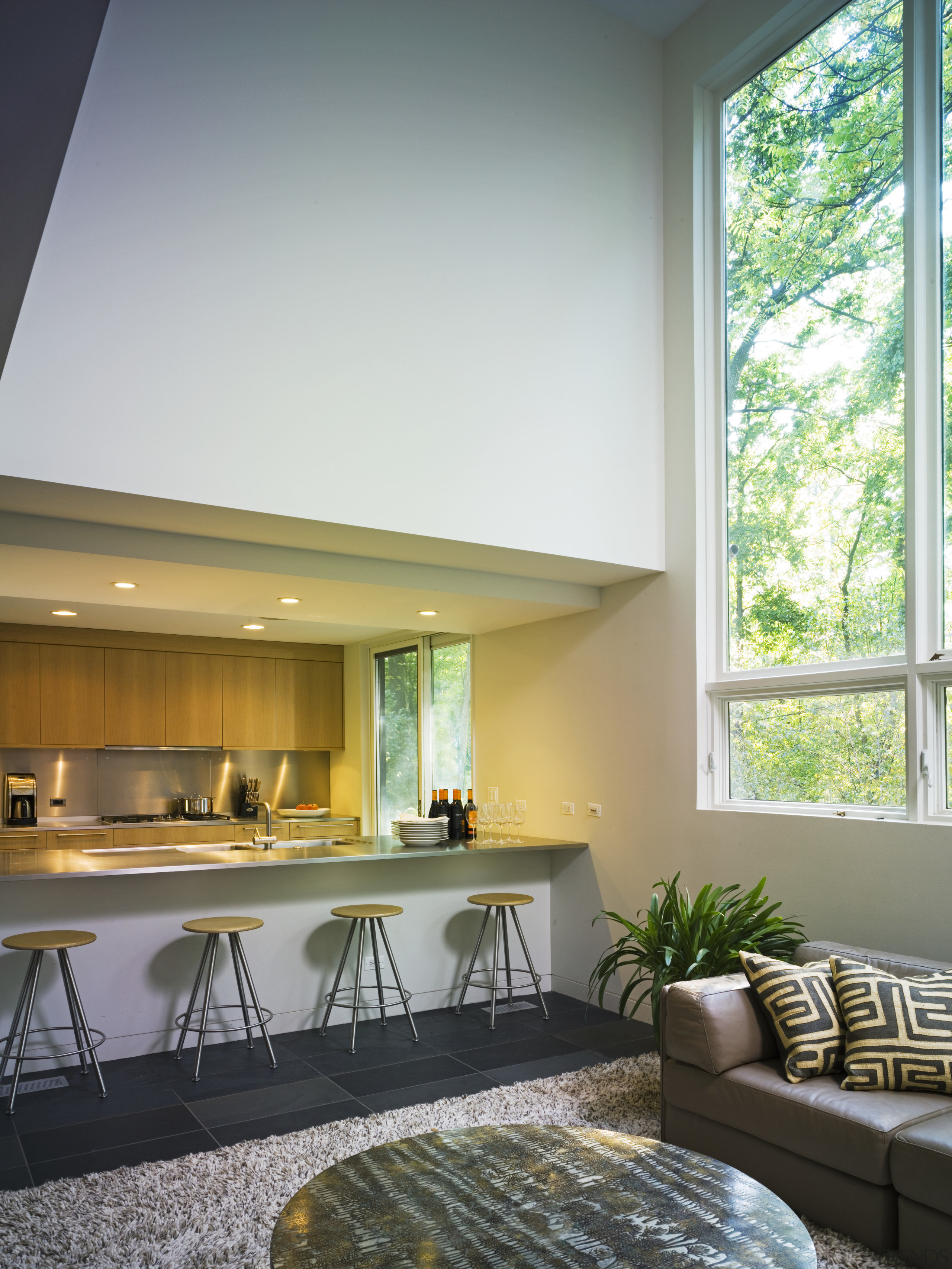 View of contemporary kitchen from the living room. architecture, ceiling, daylighting, home, house, interior design, living room, real estate, window, gray