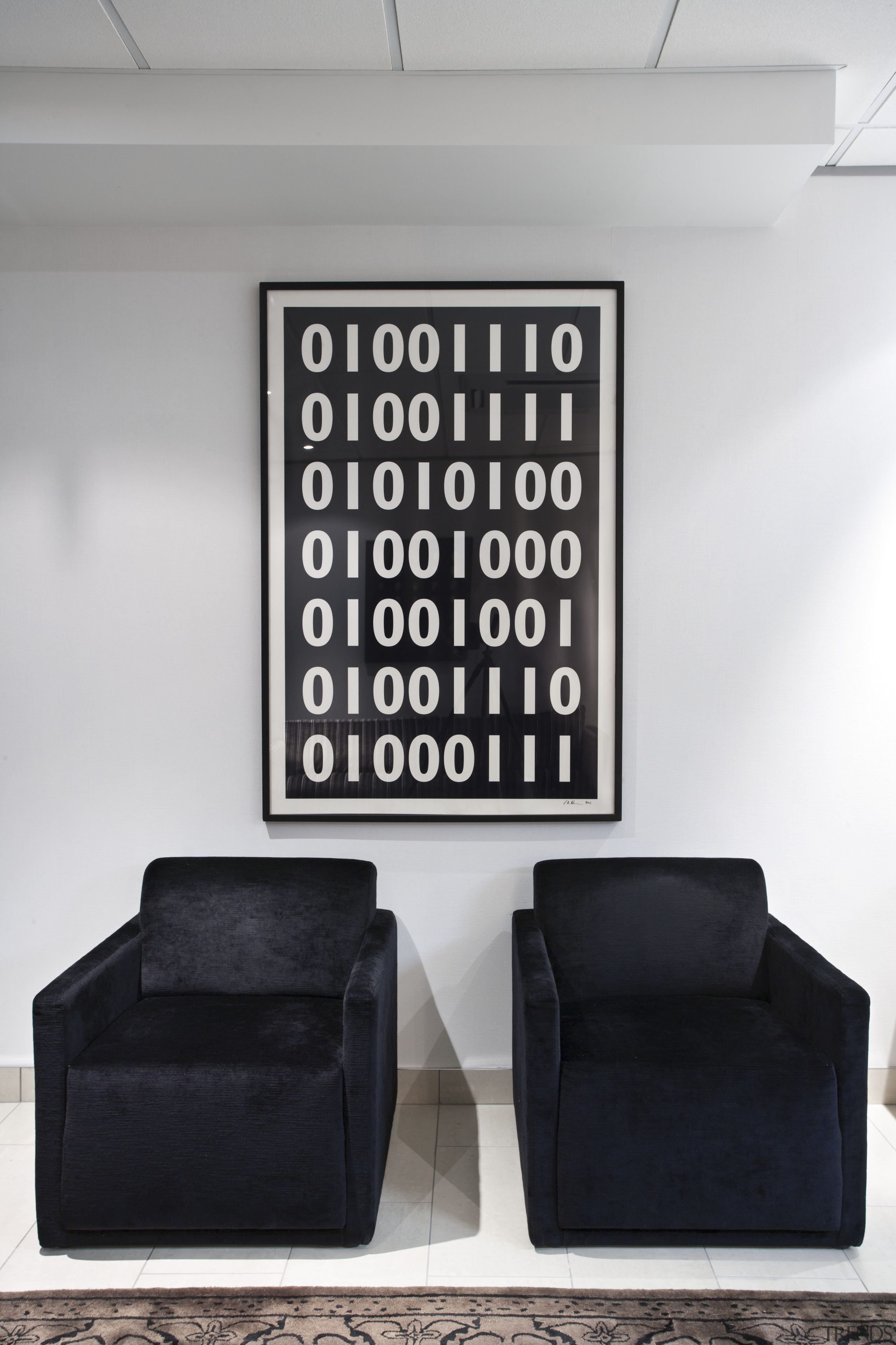 Contemporary artwork sits neatly next to furniture with font, furniture, product design, wall, gray, black