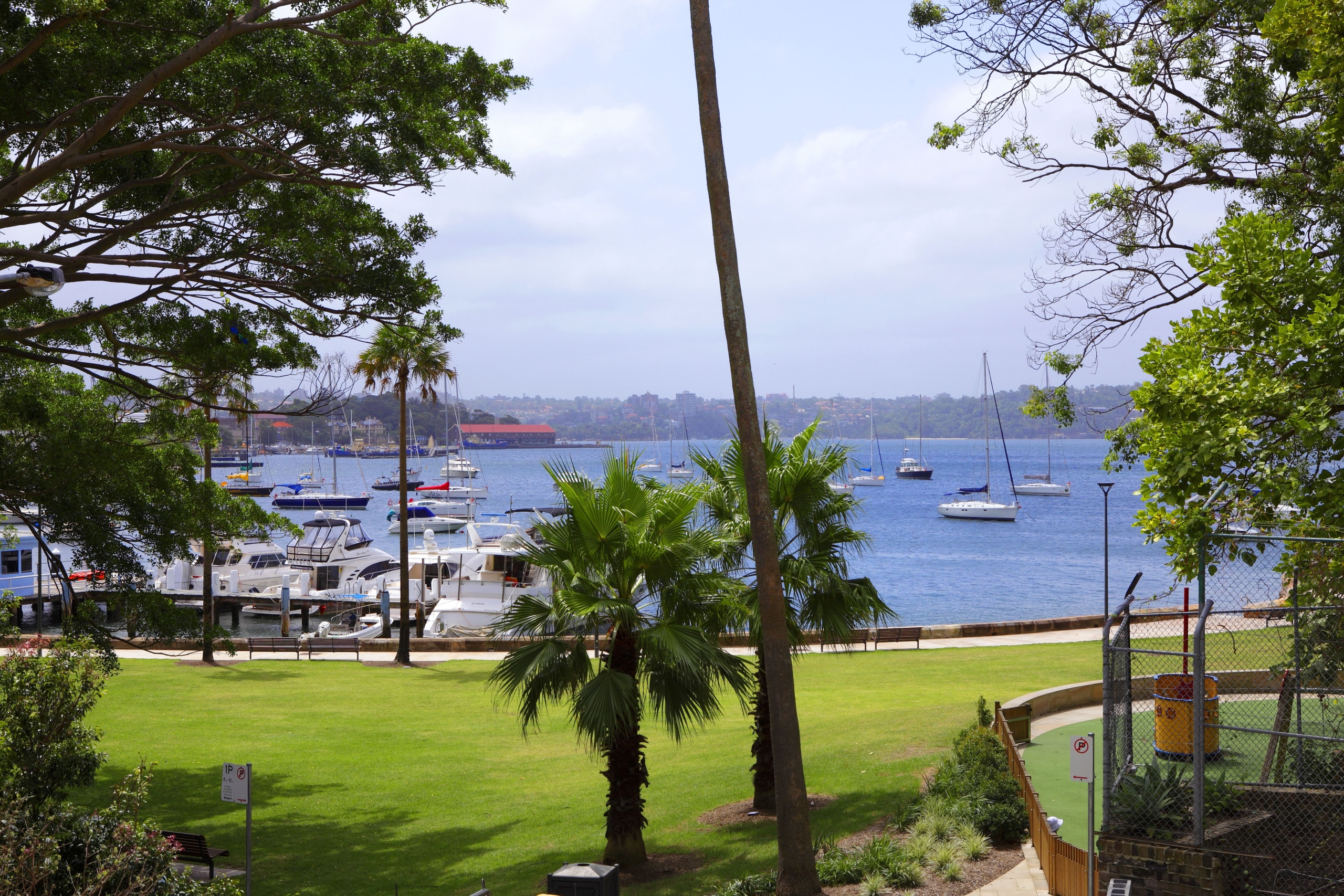 View of Elizabeth Bay from the covered patio. arecales, lake, leisure, palm tree, plant, real estate, recreation, resort, sky, tree, water, teal
