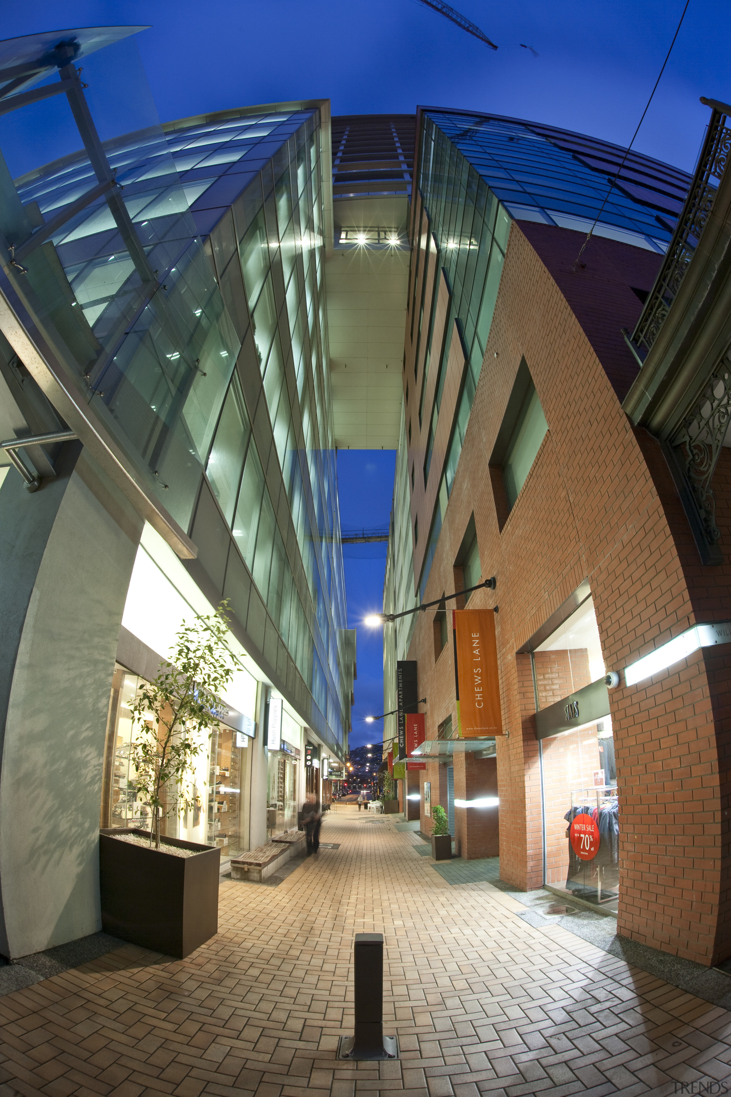 exterior view of apartment building featuring windows and architecture, building, condominium, daylighting, metropolitan area, mixed use, sky, structure, brown