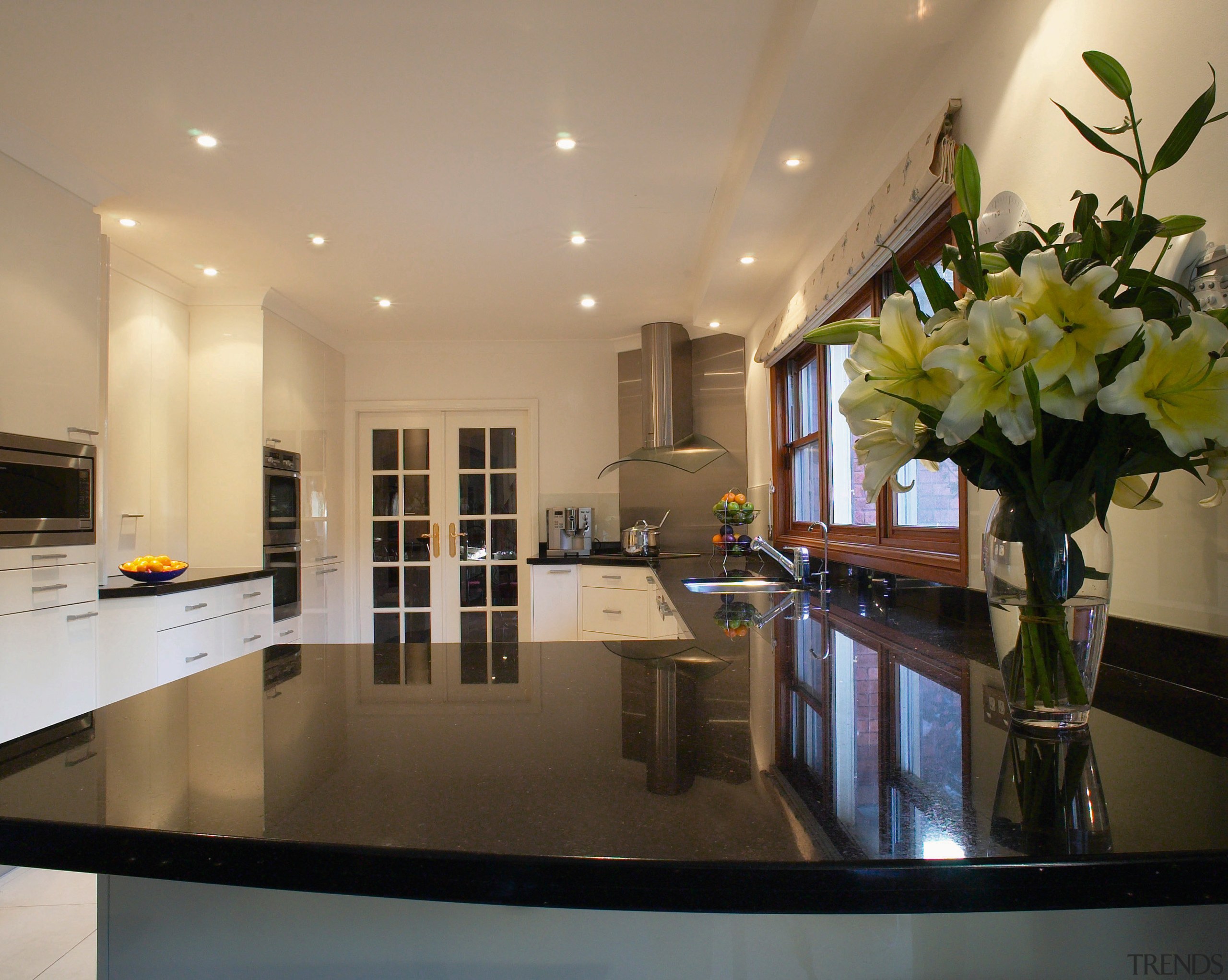 Kitchen with reflective black granite benchtops, light coloured ceiling, countertop, interior design, kitchen, property, real estate, room, brown