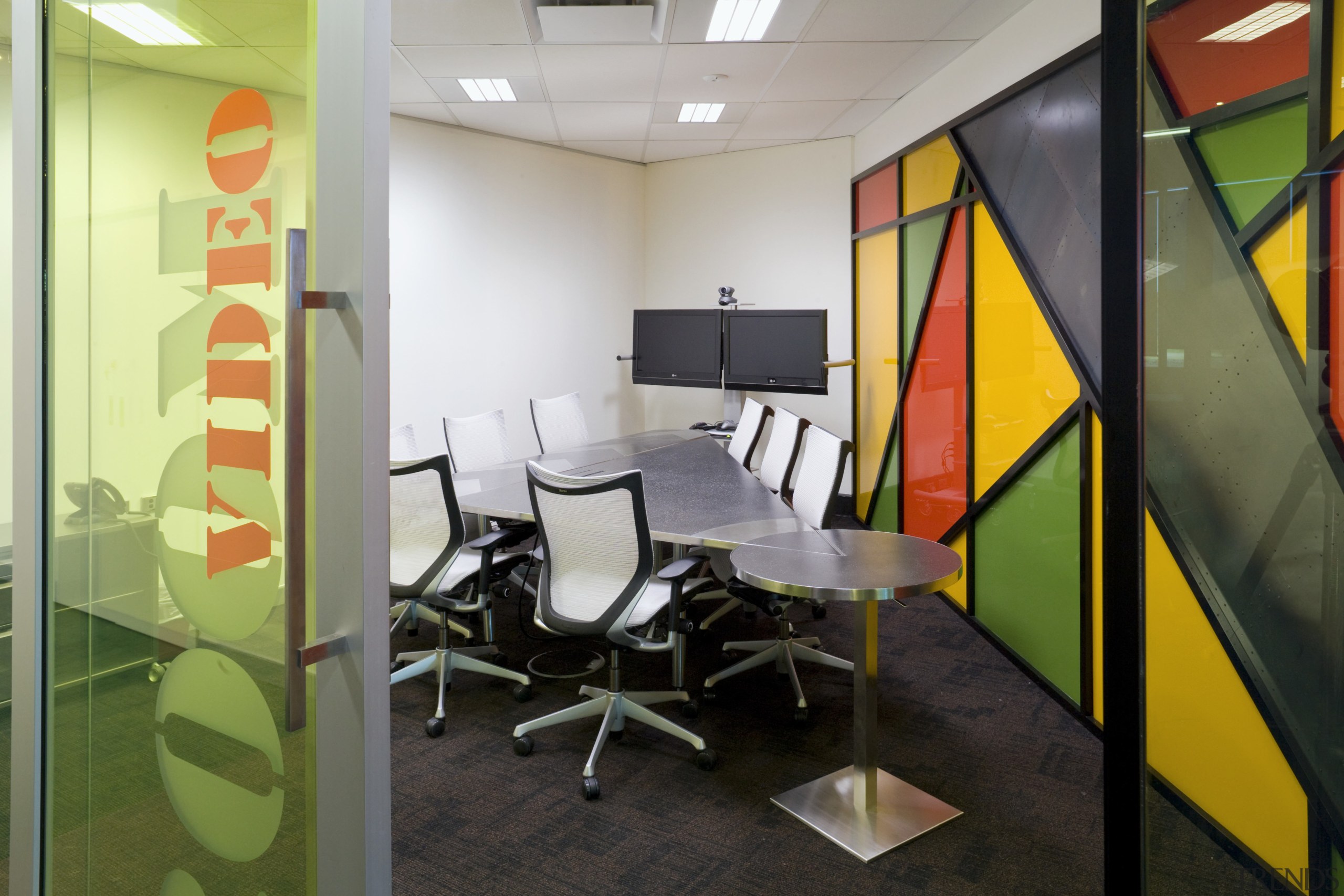 A triangular table enhances this unusally shaped meeting interior design, office, real estate, black