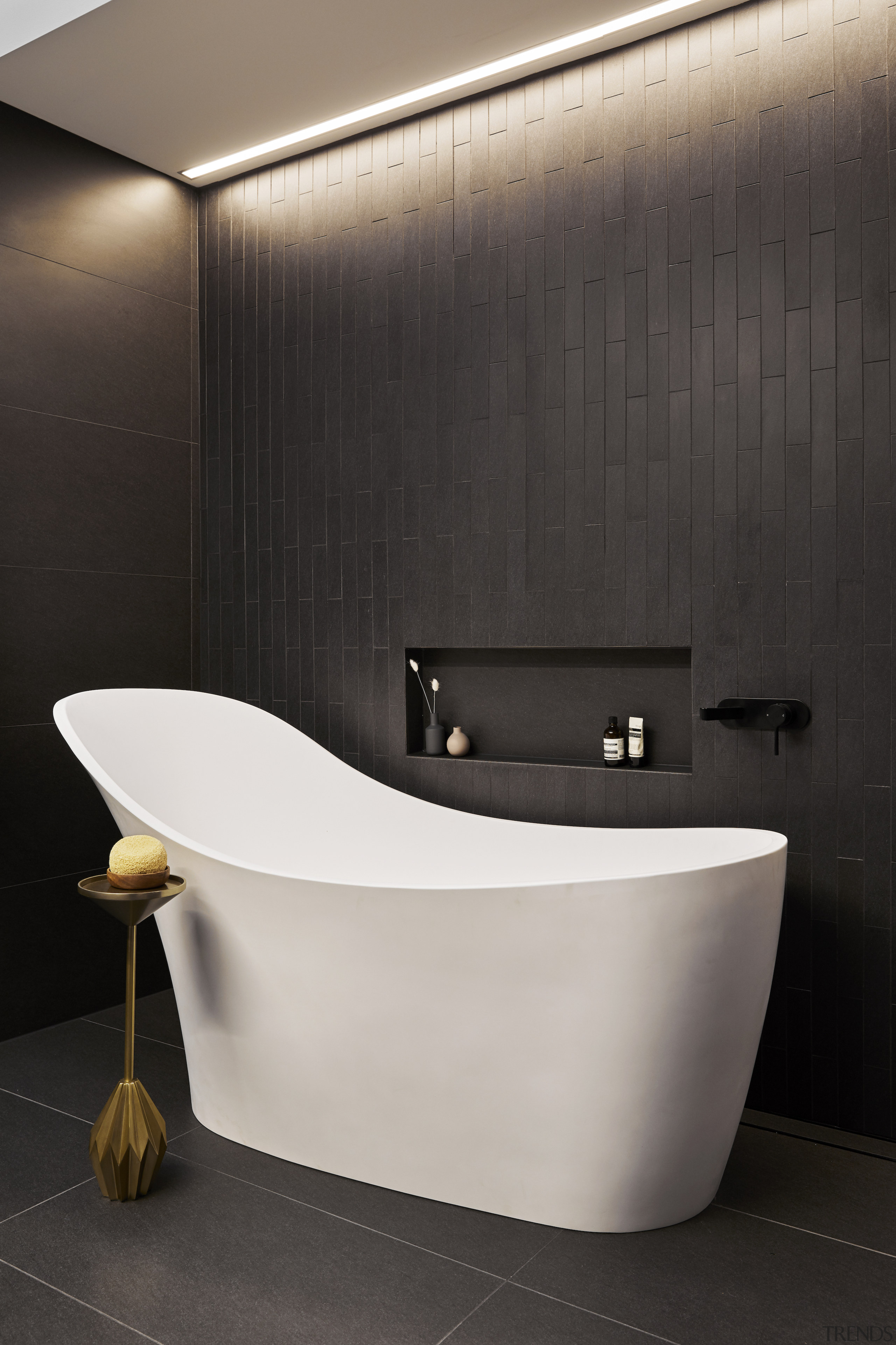 The wall-set bath filler is ideally positioned at the 