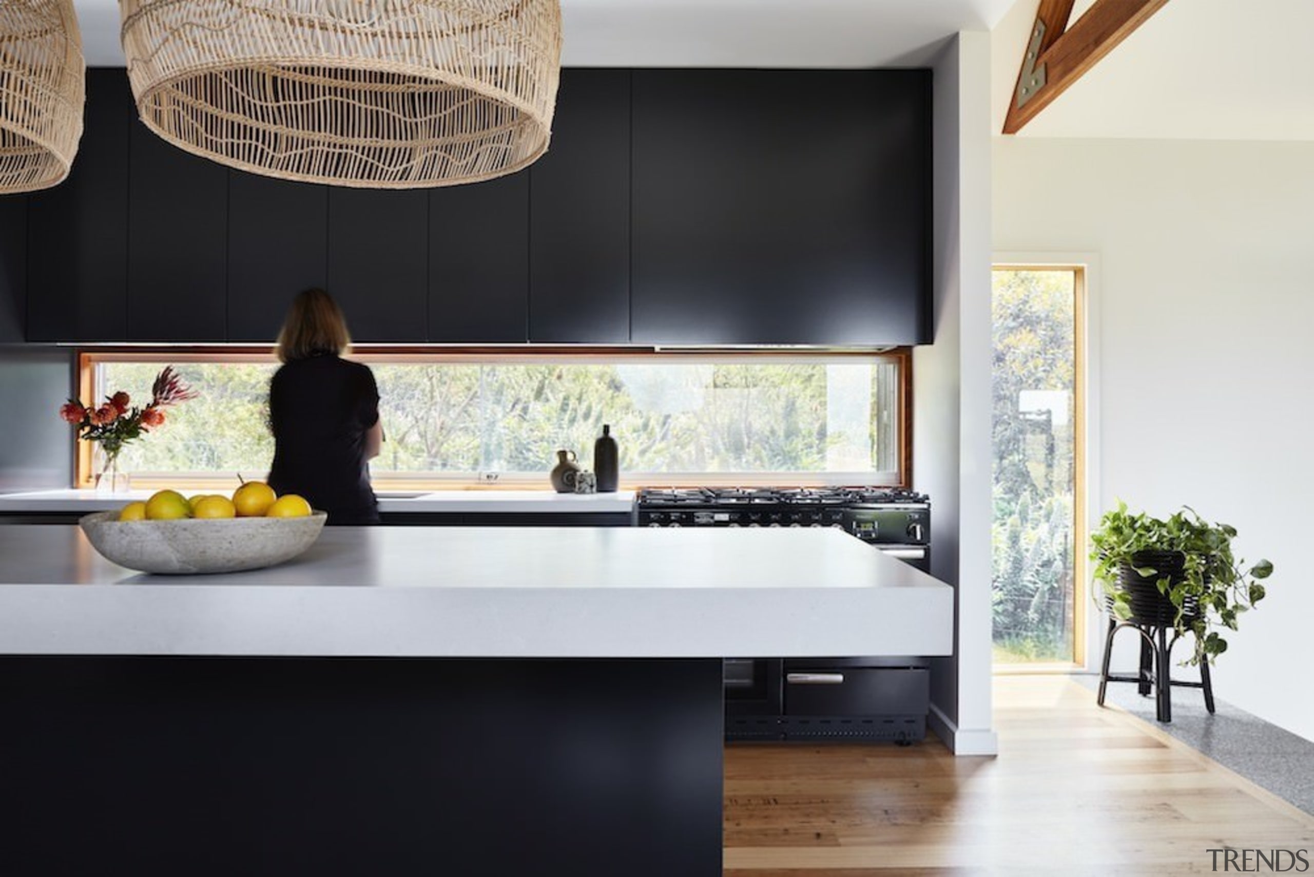 A black and white kitchen is simple, with countertop, furniture, interior design, kitchen, product design, room, table, black, white