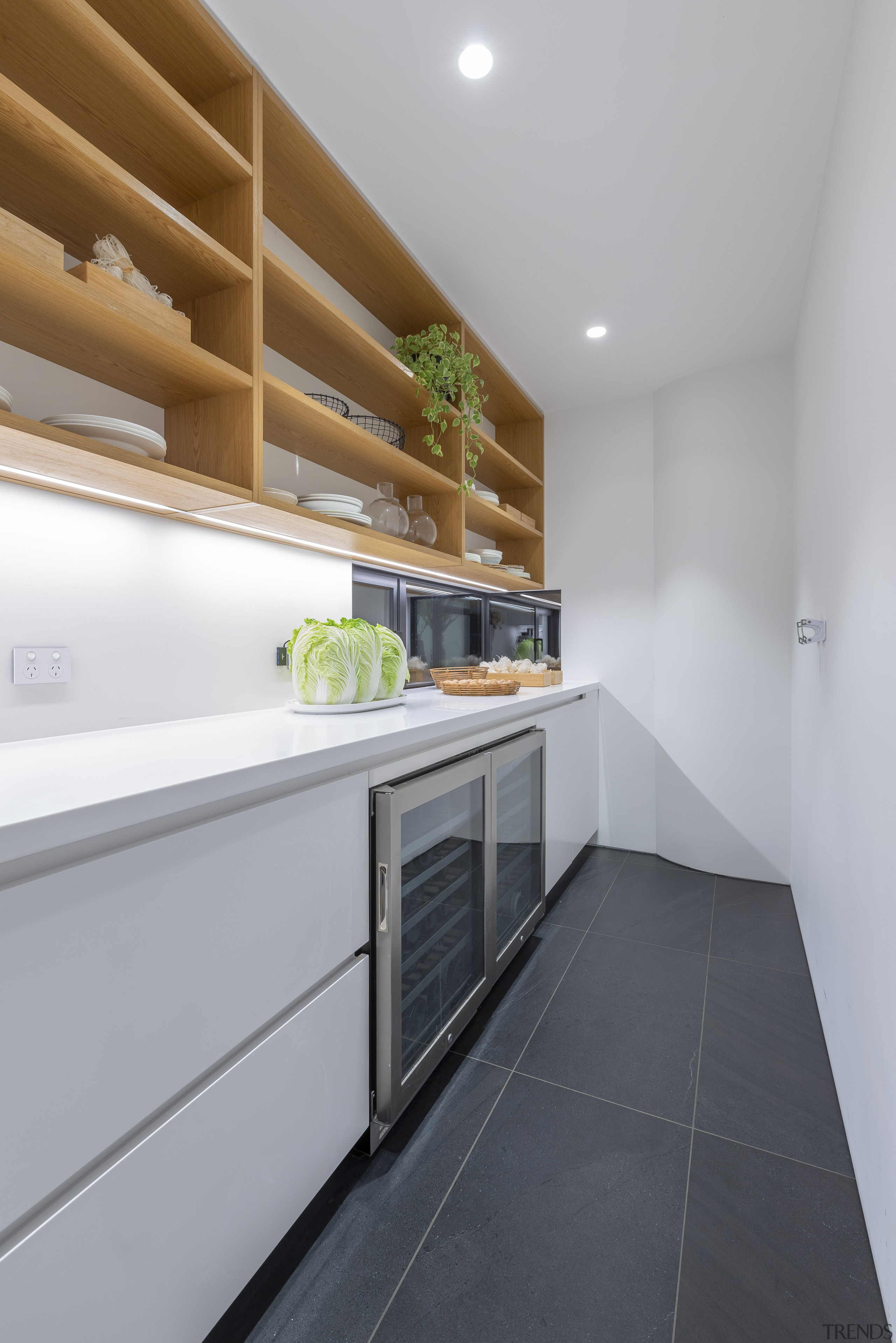 Black floor tiles seen in the living spaces 