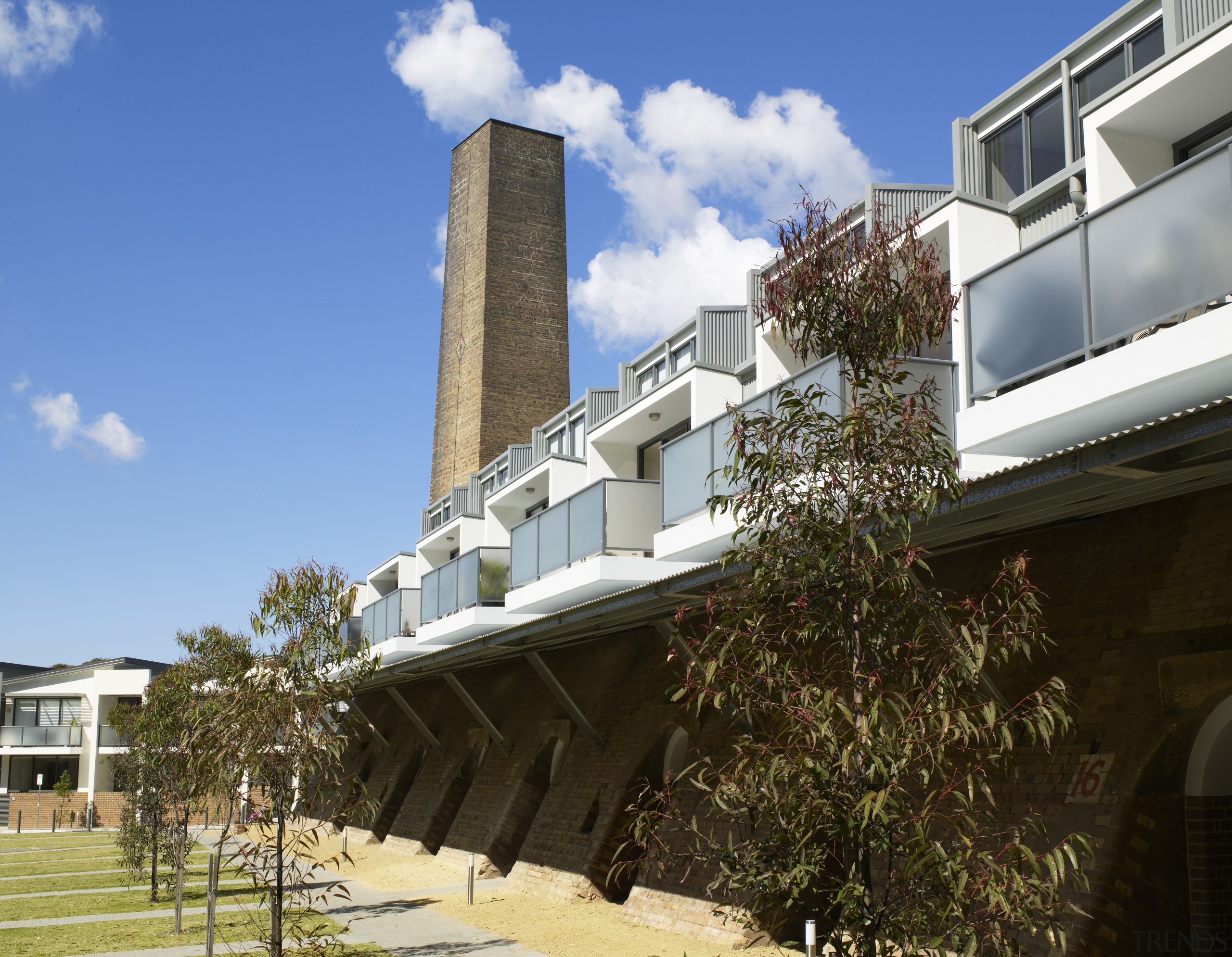 Two-storey apartments are built within the original awning apartment, architecture, building, condominium, estate, facade, home, house, property, real estate, residential area, roof, sky, teal