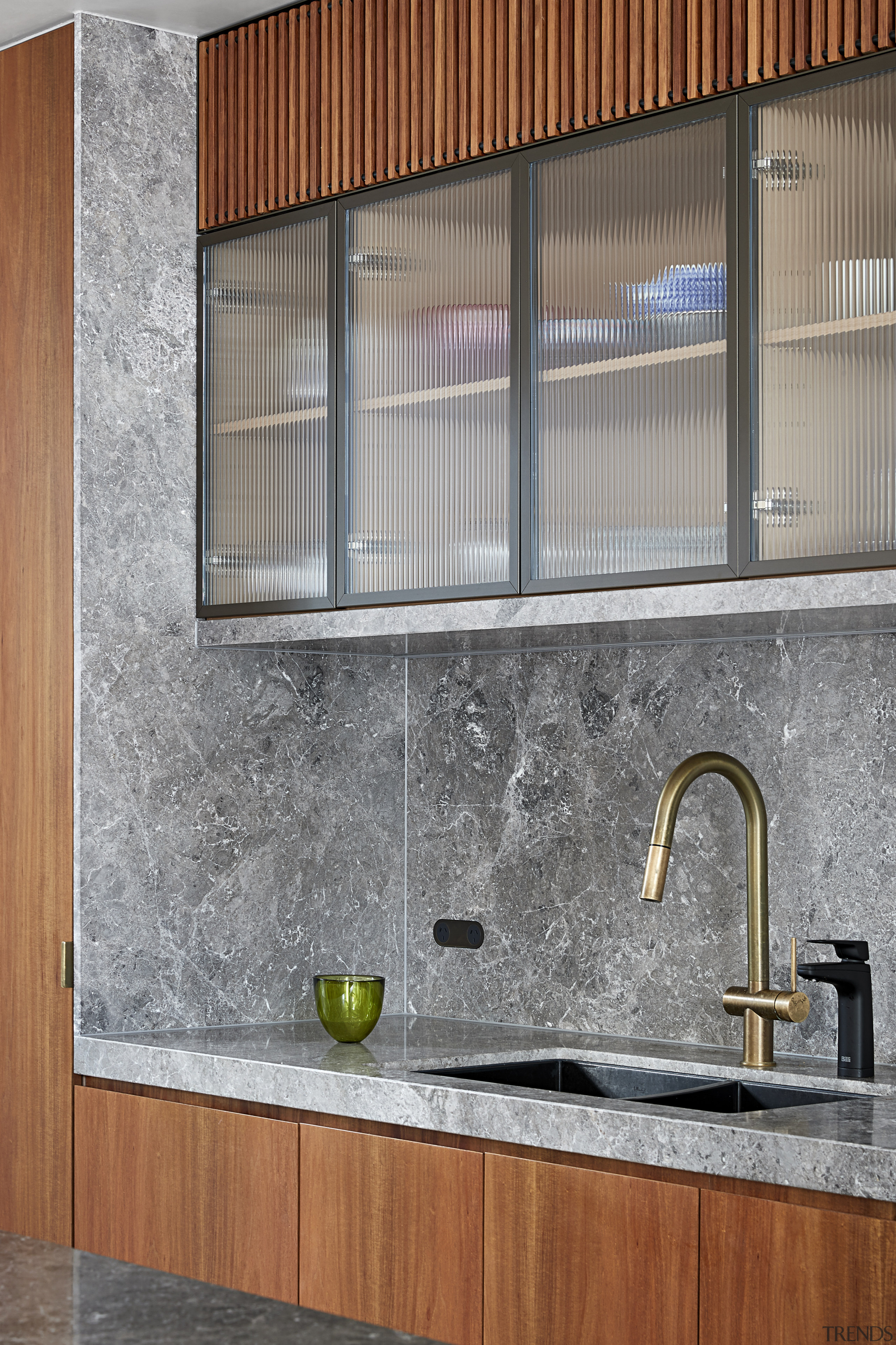The reeded glass overhead cupboard doors, framed in 