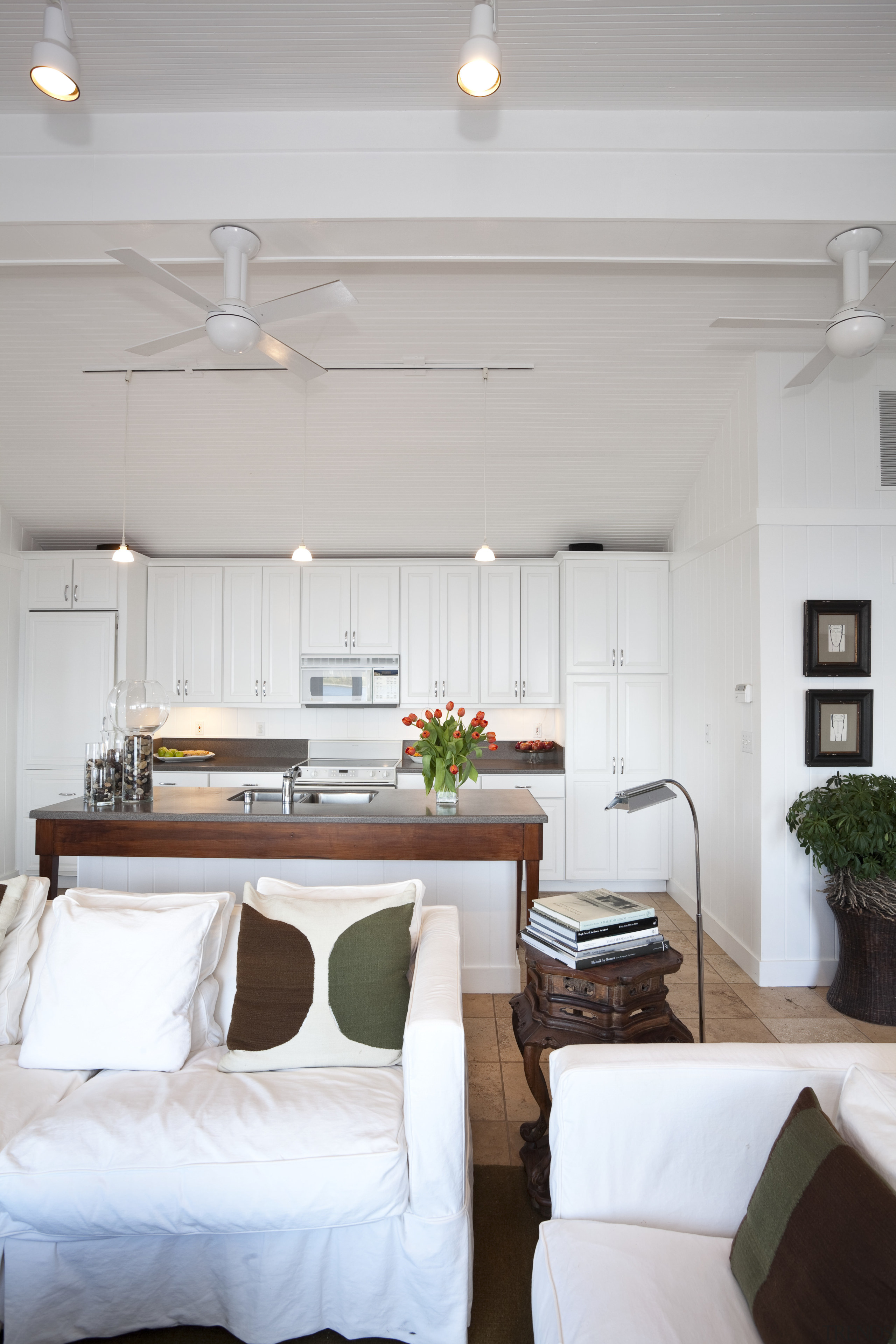 Lounge with white couches, white walls and white ceiling, furniture, home, house, interior design, living room, real estate, room, table, gray, white