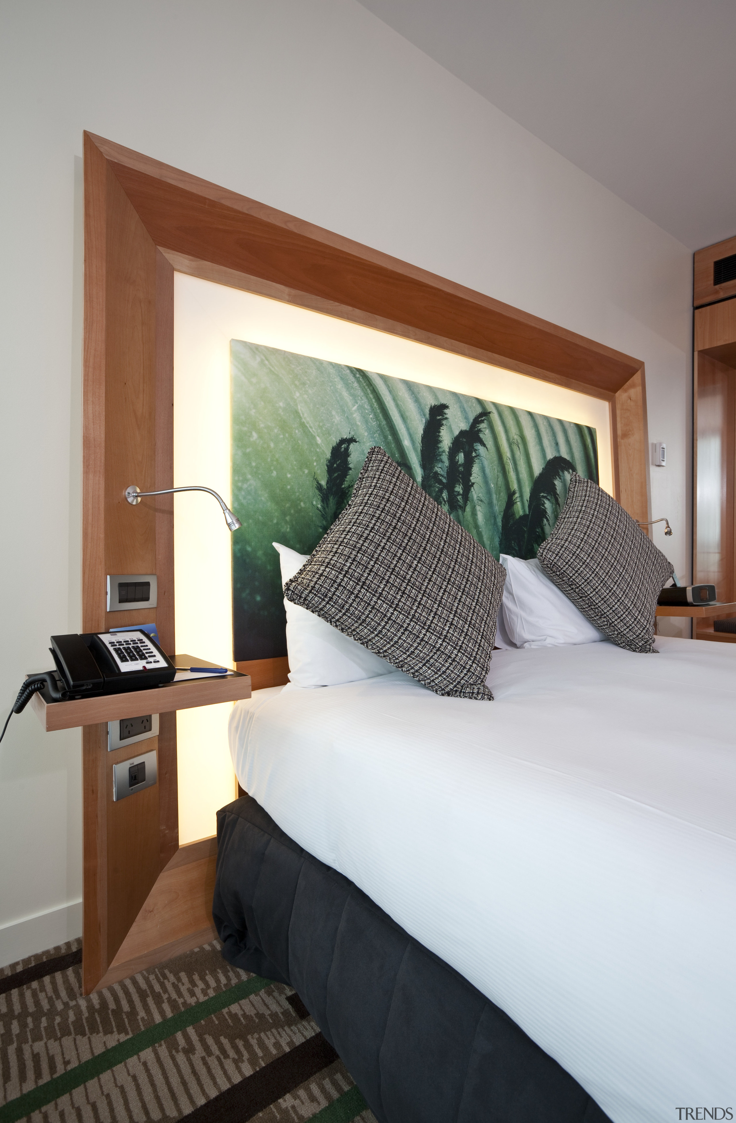 View of a guest room in the Novotel bed, bed frame, bedroom, ceiling, floor, furniture, home, interior design, real estate, room, suite, wall, window, wood, gray, white