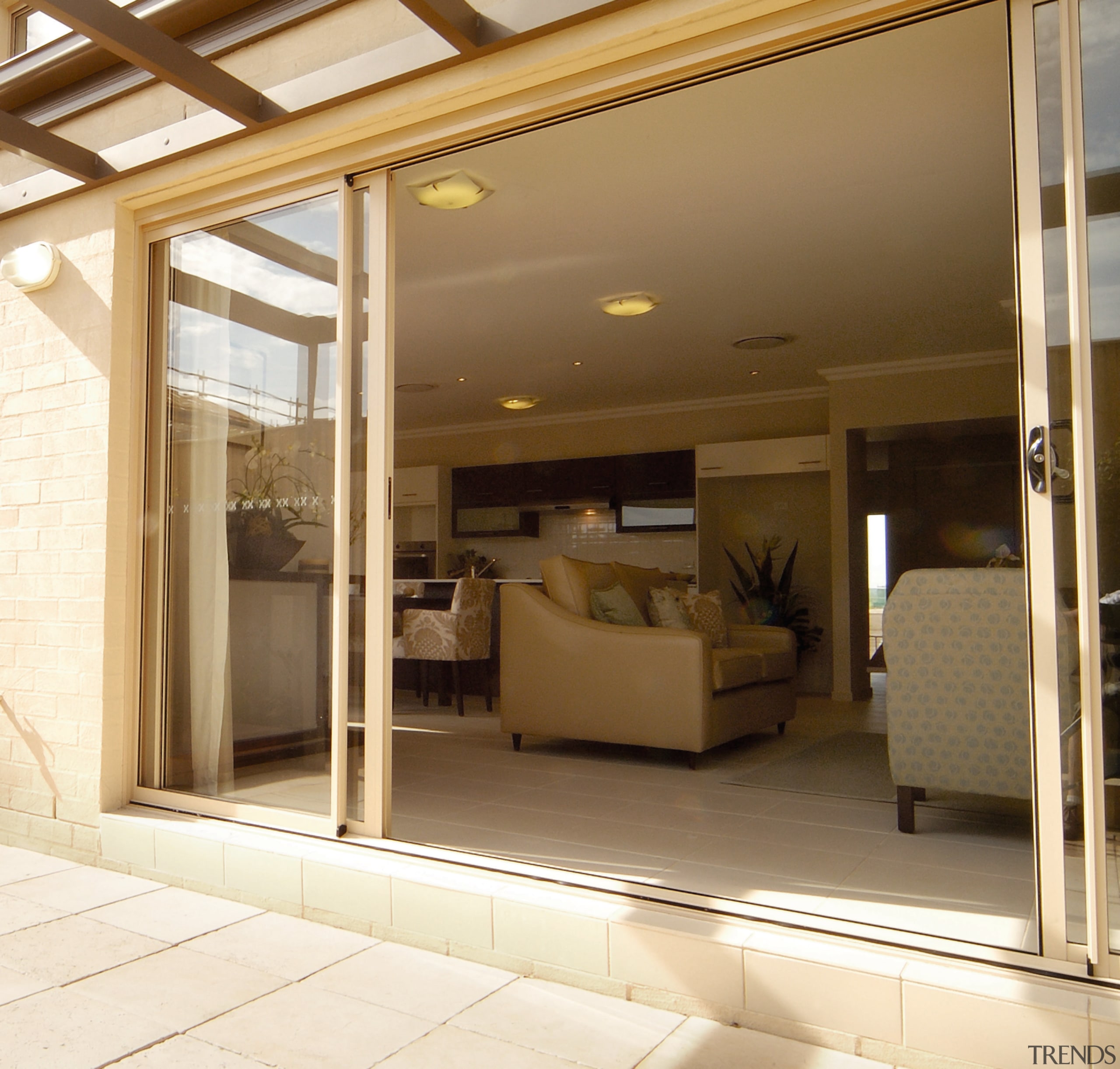 View through glass sliding doors into lounge area ceiling, door, floor, interior design, window, brown, yellow