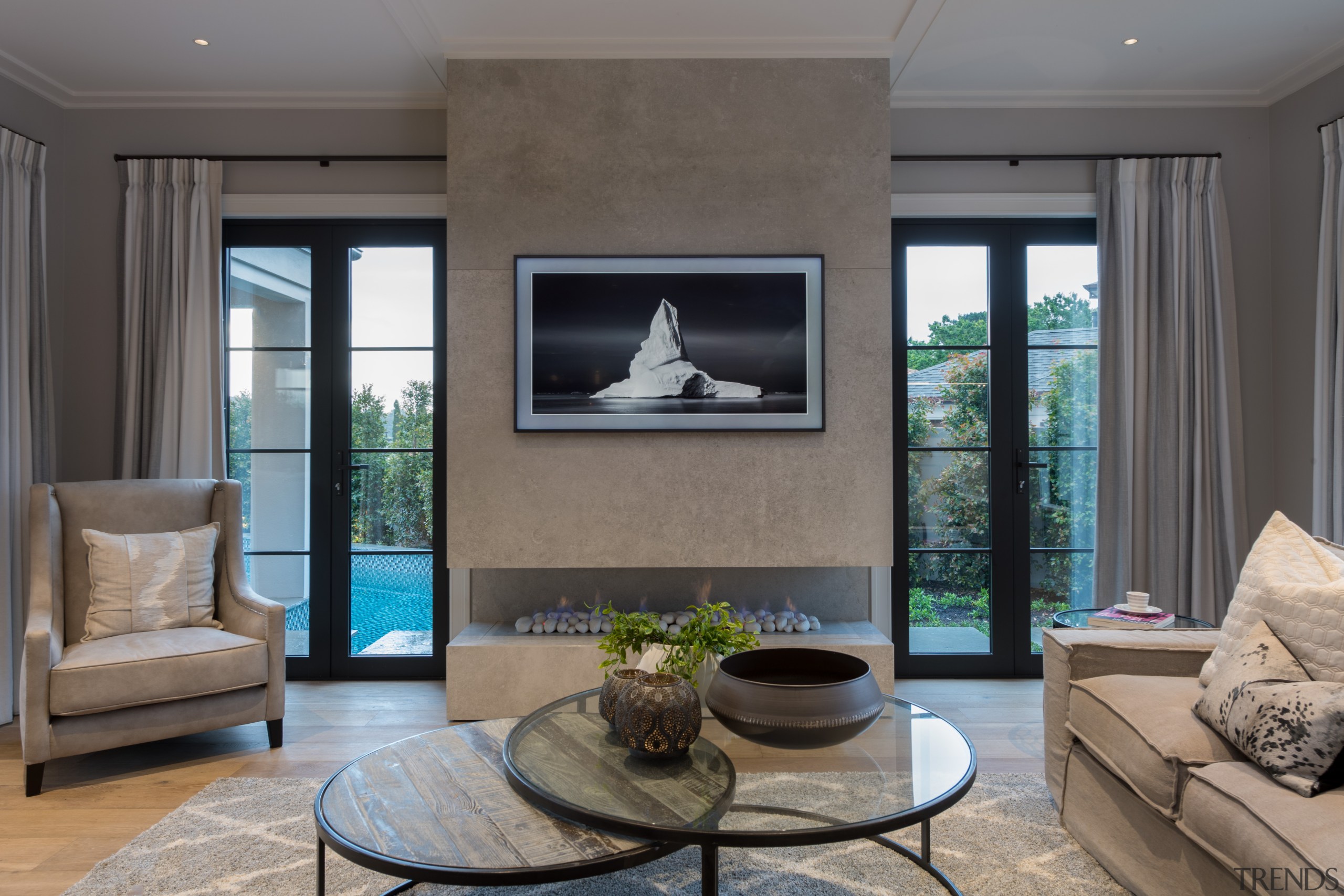 The family room takes in the pool as 