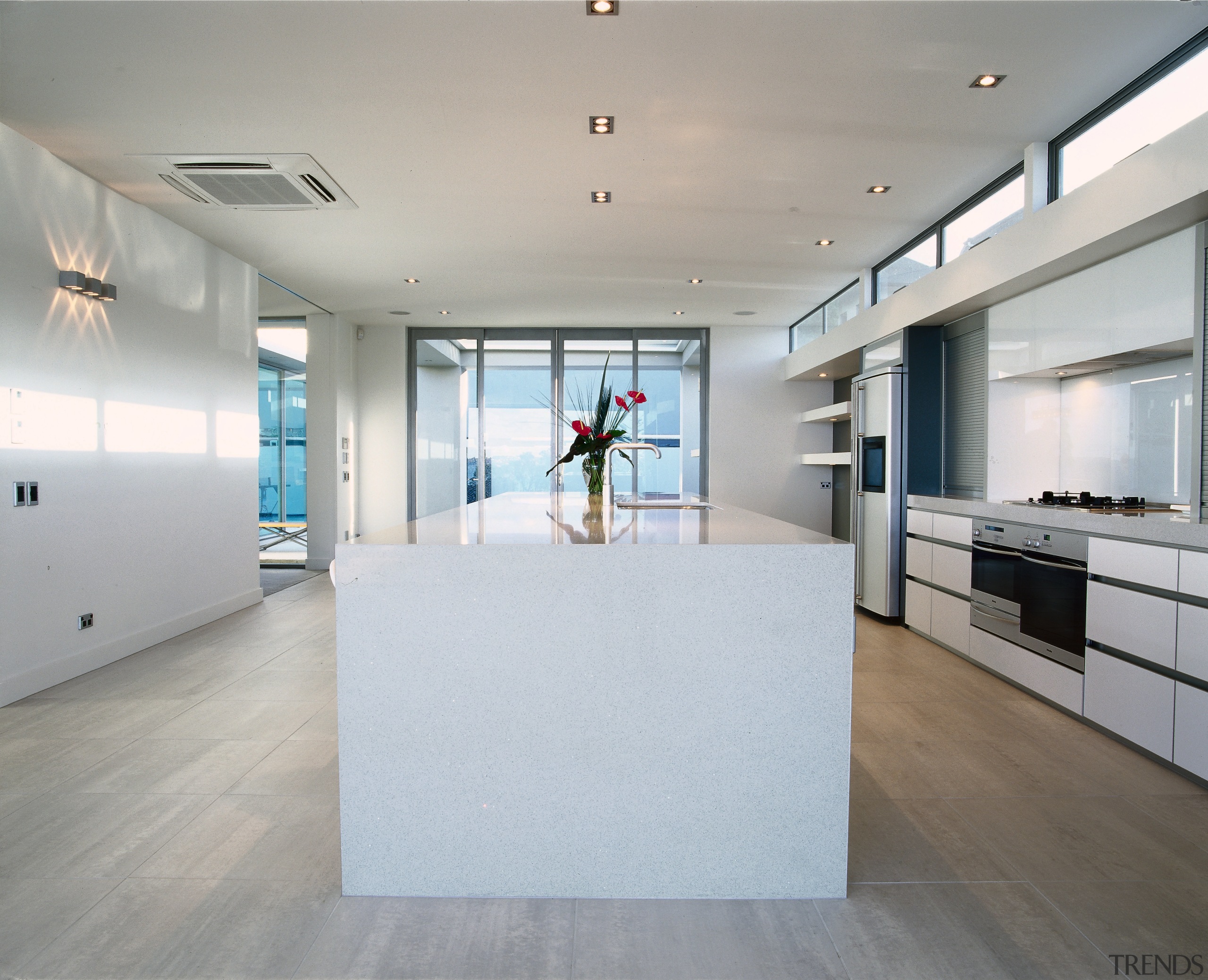 view of the kitchen lengthwise  showing timberflooring apartment, architecture, daylighting, floor, flooring, house, interior design, real estate, wood flooring, gray