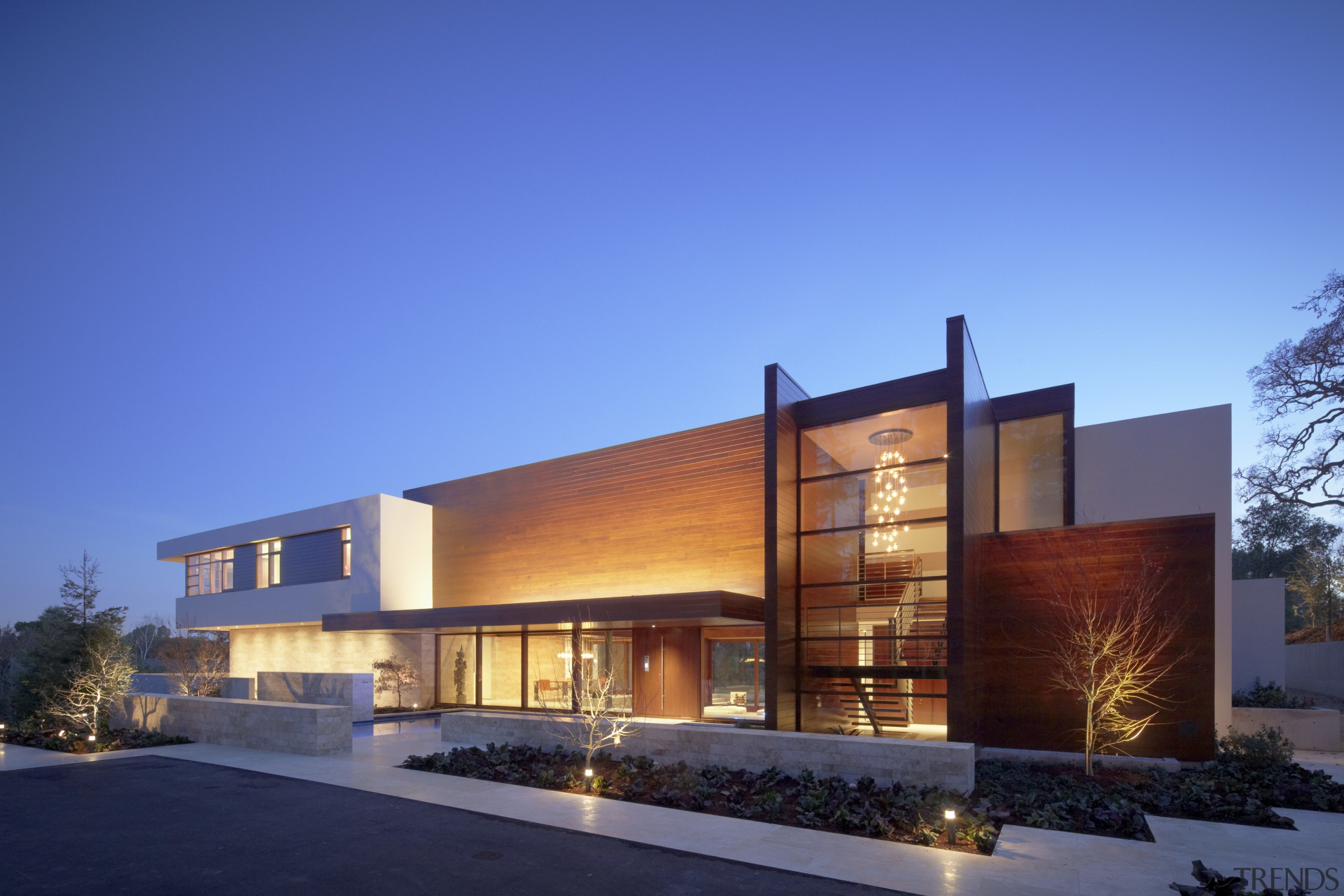 Exterior view of the home from the pool.The architecture, building, commercial building, corporate headquarters, elevation, estate, facade, home, house, lighting, mixed use, property, real estate, residential area, sky, blue