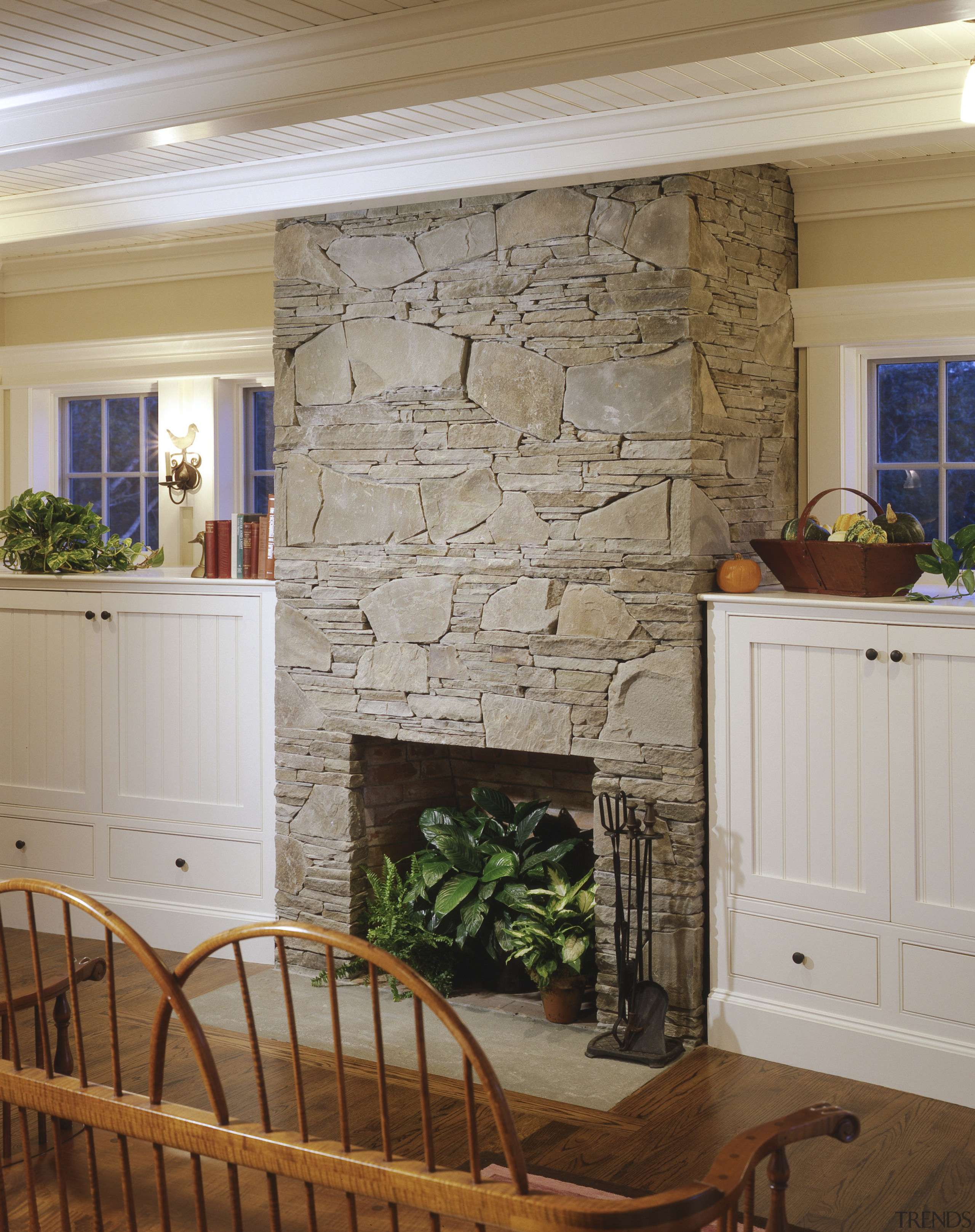 View of slate fireplace in sitting area with cabinetry, ceiling, fireplace, floor, flooring, hardwood, hearth, home, interior design, living room, room, wall, window, wood flooring, wood stain, brown, gray