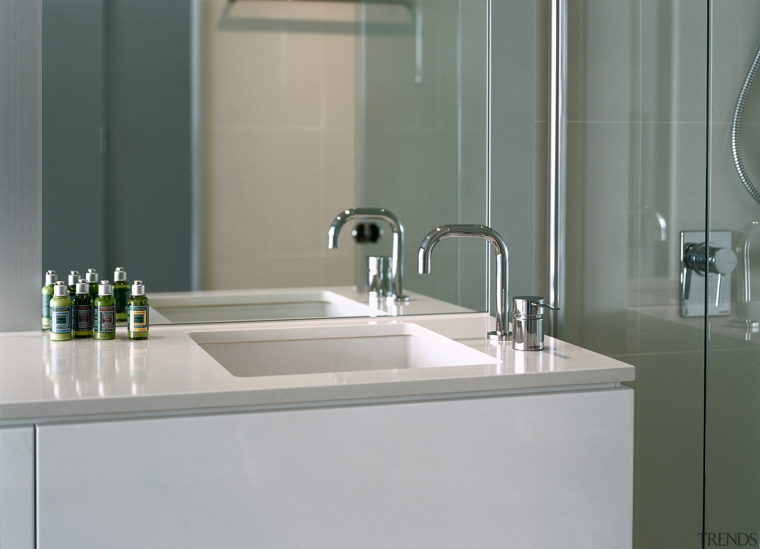 Bathroom with white and cream vanity, square basin bathroom, bathroom accessory, bathroom cabinet, bathroom sink, ceramic, countertop, glass, interior design, plumbing fixture, product design, sink, tap, tile, gray