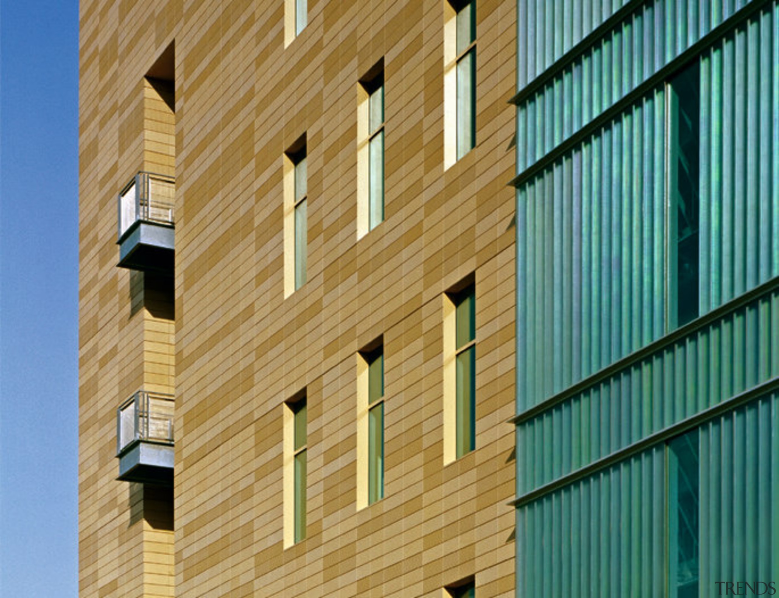 A close up view of the brick walls, apartment, architecture, brickwork, building, commercial building, daylighting, daytime, facade, house, line, siding, structure, symmetry, wall, window, wood, teal