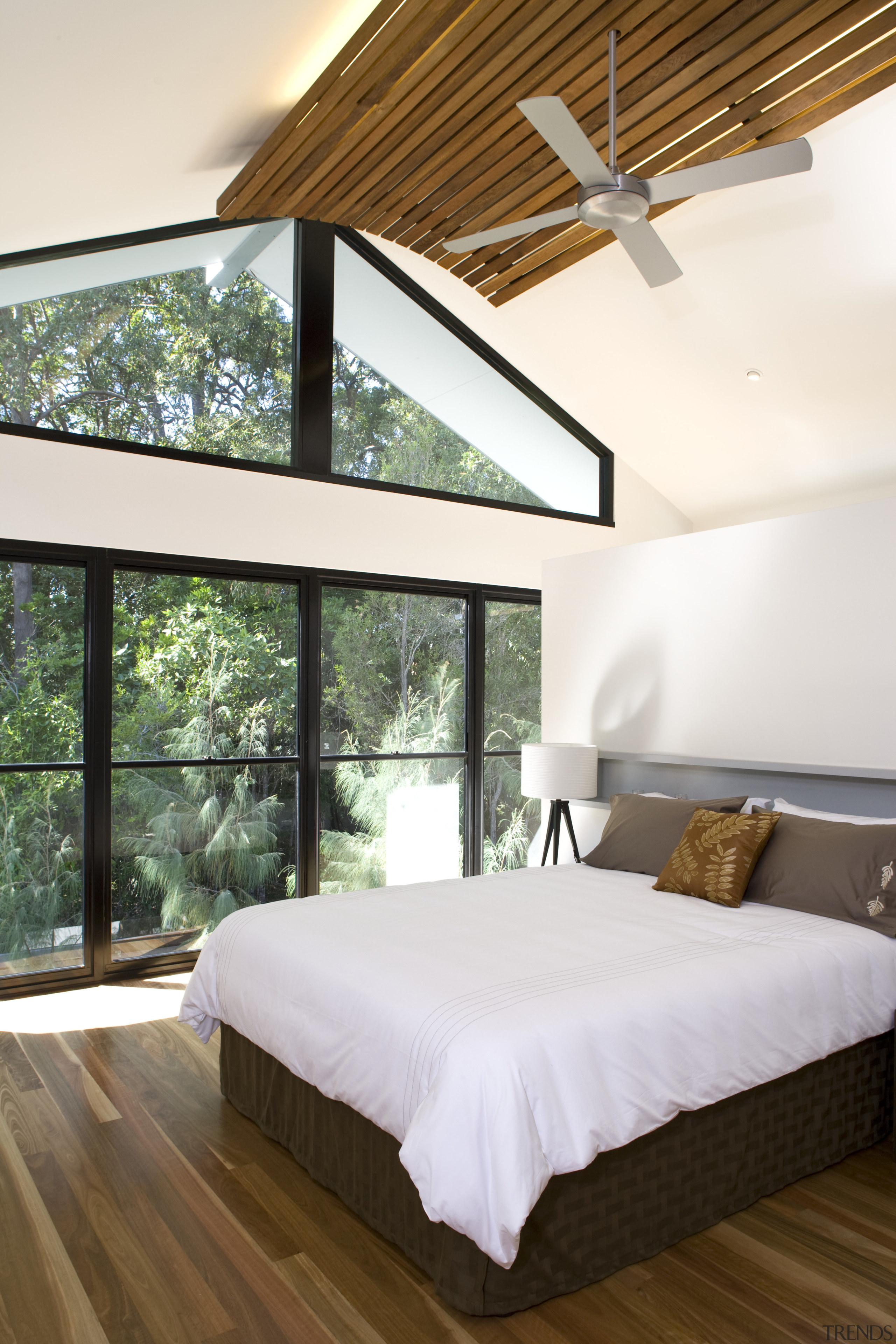 Windows that are almost floor-to-ceiling give the impression architecture, bed, bed frame, bedroom, ceiling, daylighting, estate, floor, hardwood, home, house, interior design, mattress, real estate, room, window, wood, white, brown