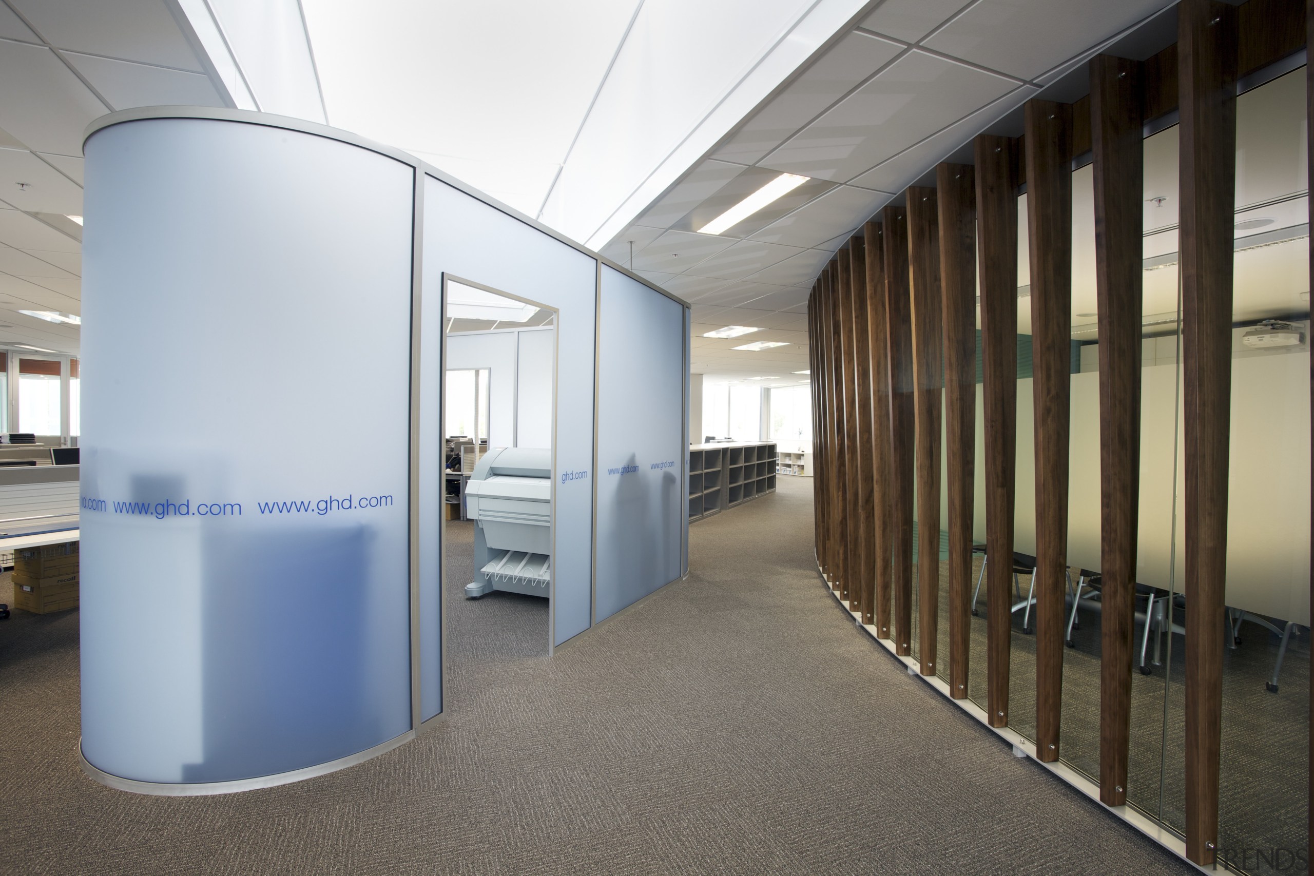 Large timber fin screens wrap around the central office, real estate, gray