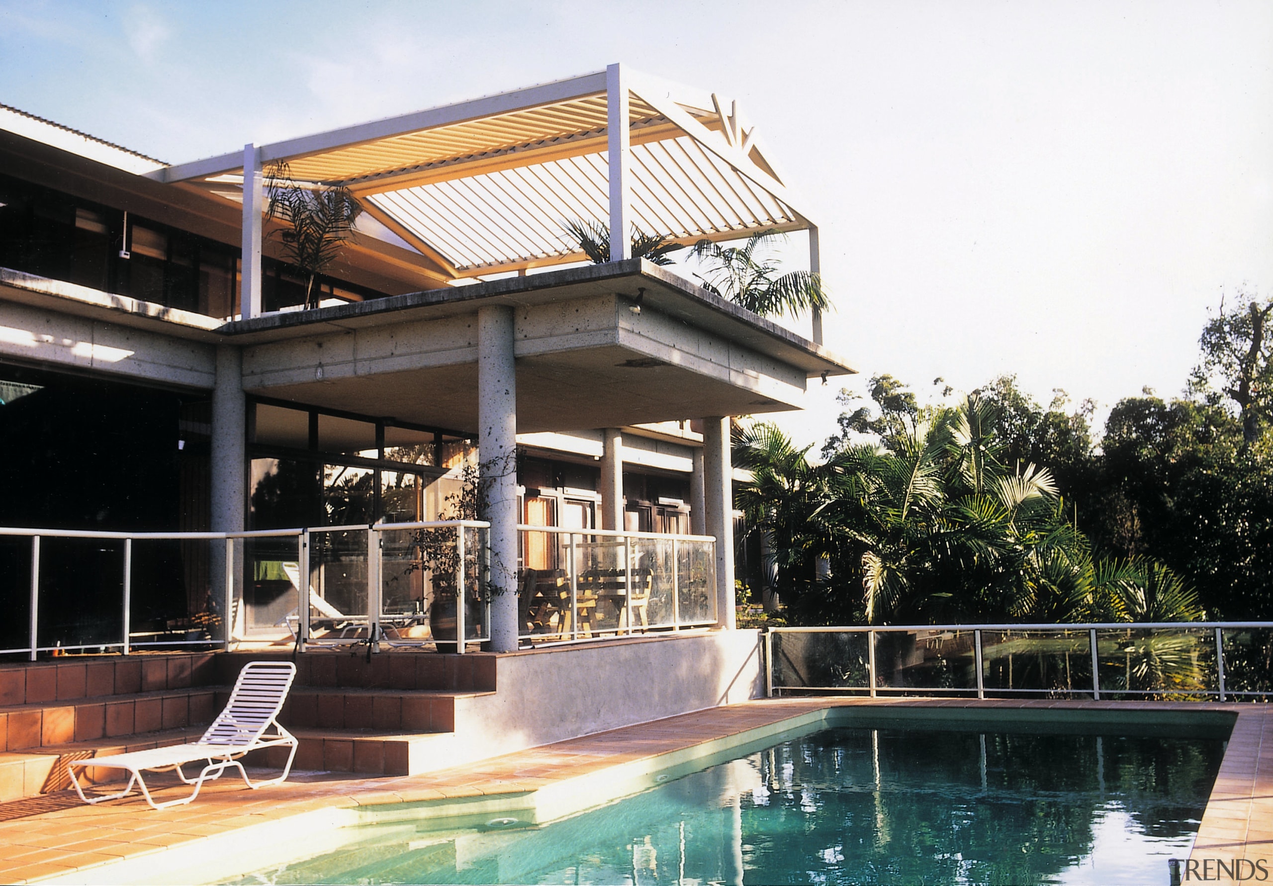 Exterior view of pool and patio area showing architecture, building, estate, house, outdoor structure, property, real estate, residential area, swimming pool, villa, white, black