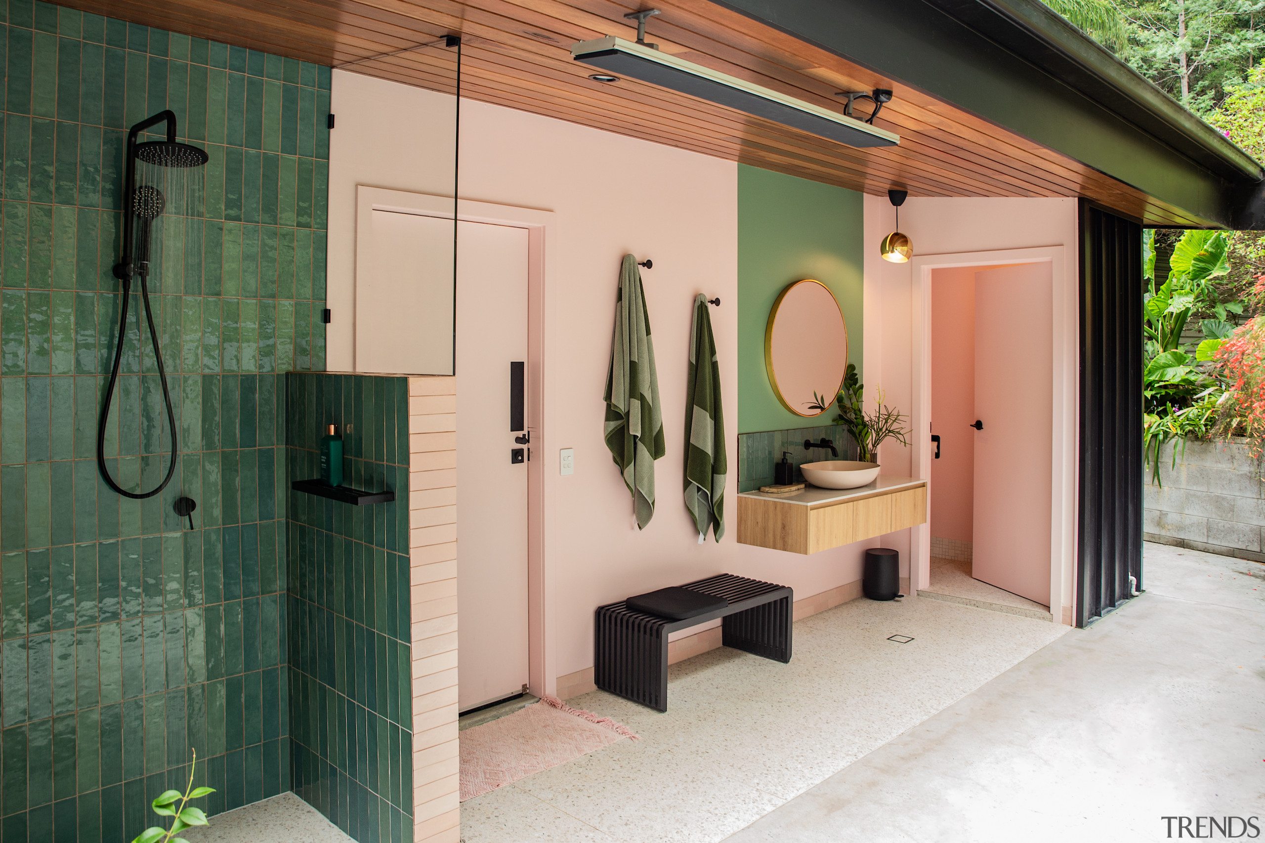 The addition includes an outdoor bathroom with an 