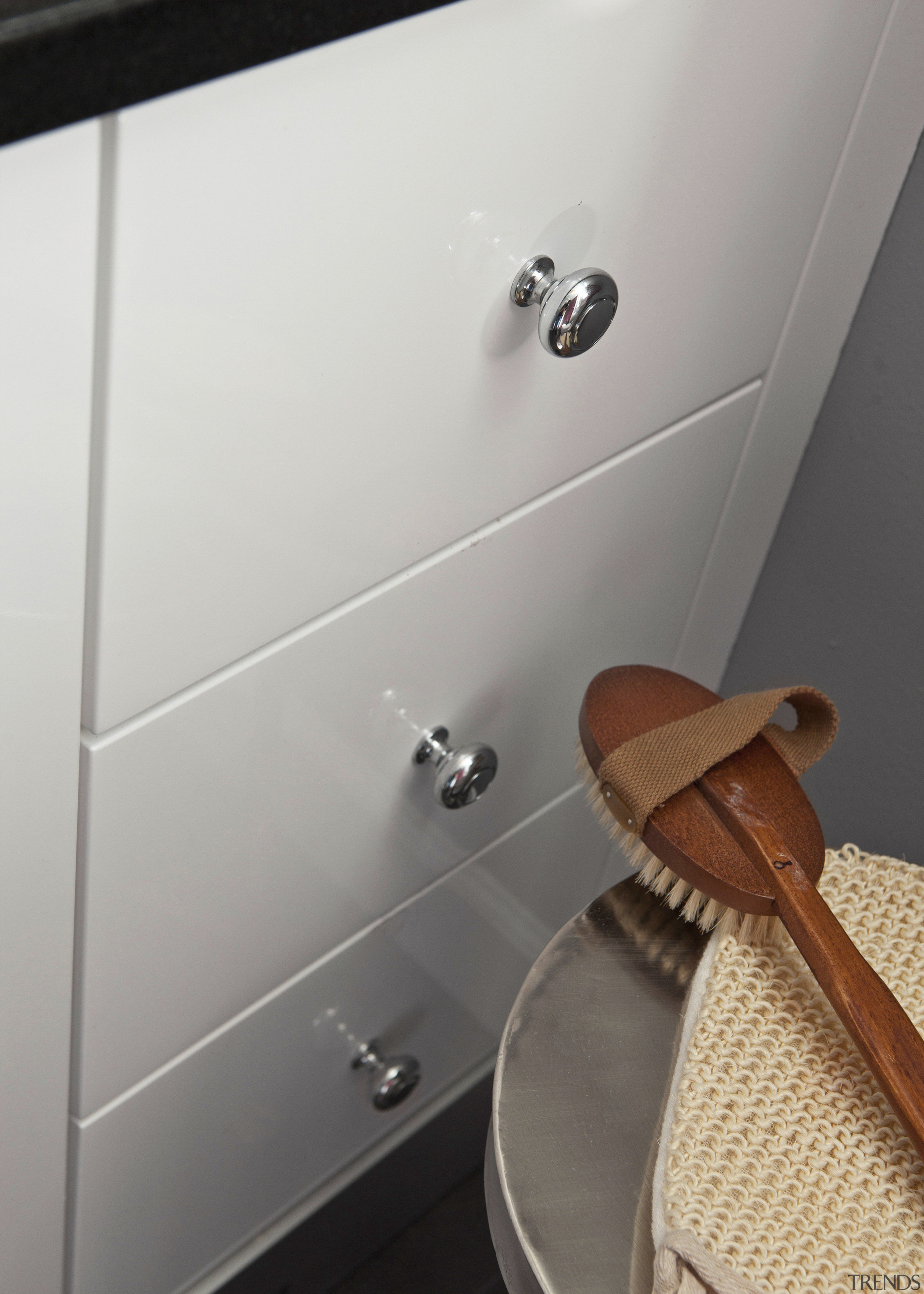 View of drawers and body scrubbing brush. - bathroom, floor, plumbing fixture, product design, room, sink, tap, toilet seat, gray